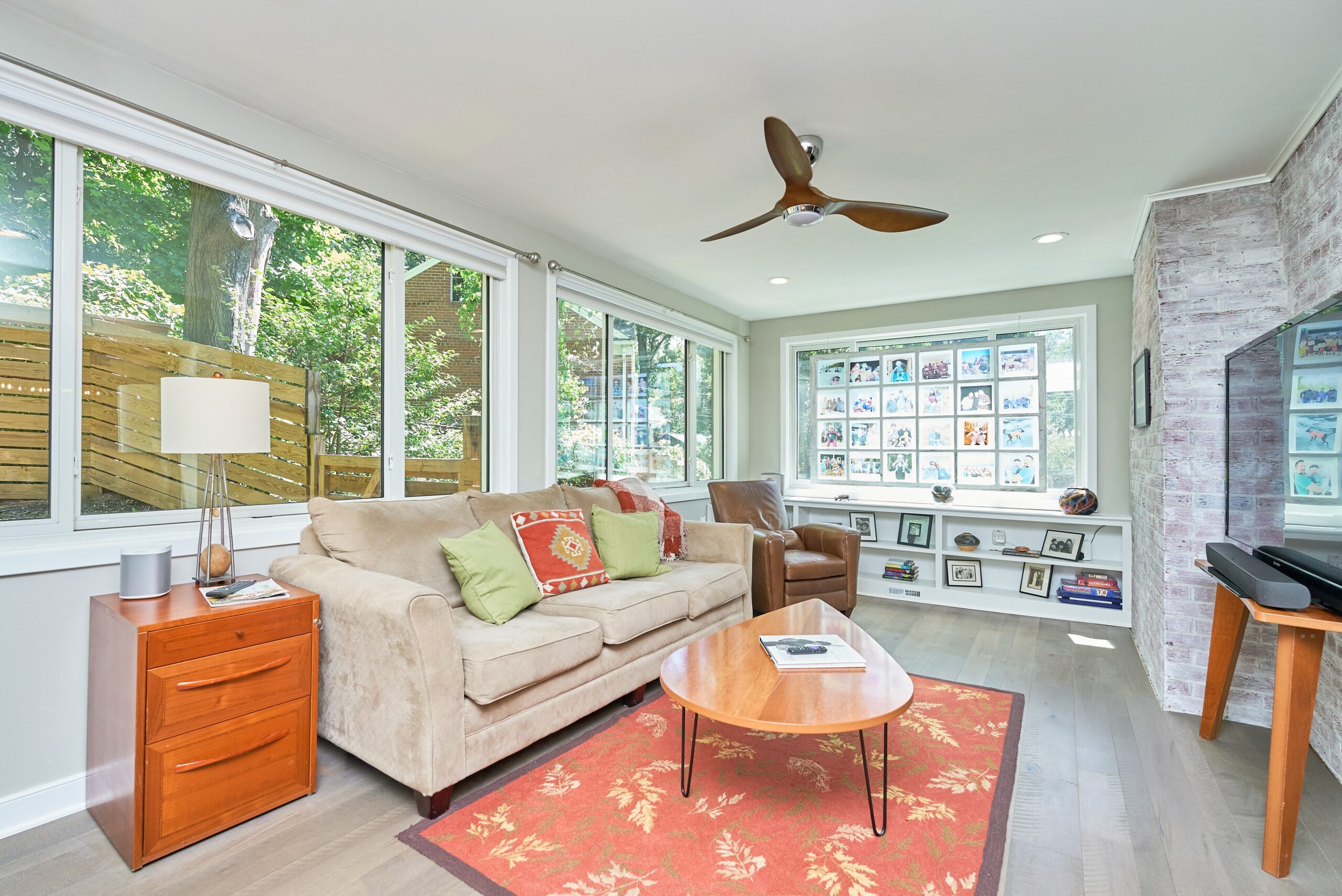 Professional photo of interior of custom home in Falls Church, Virginia. Shows TV area with windows on two sides.