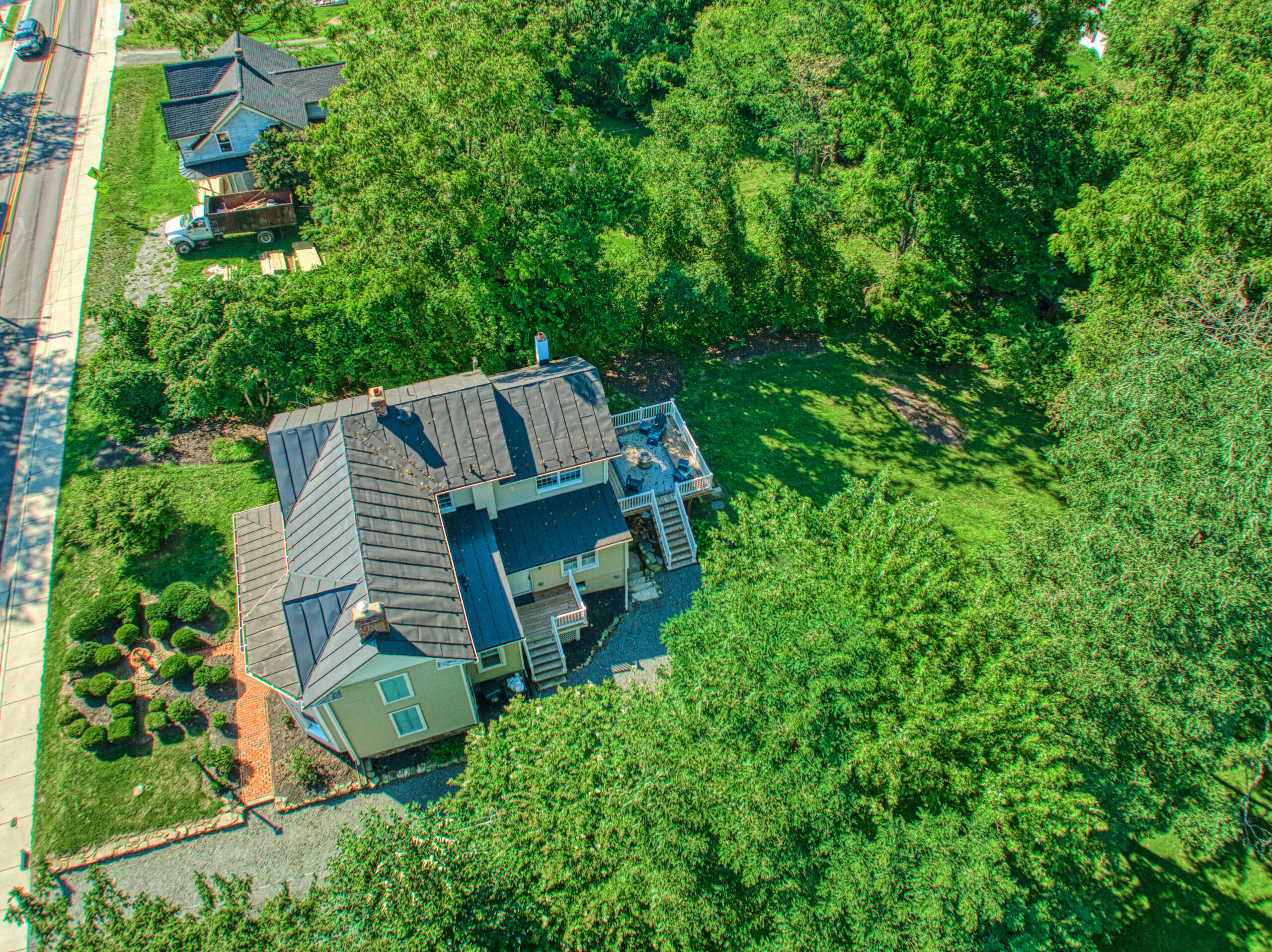 Aerial view taken with a drone of historic home in Hamilton, Virginia showing the unique shape of the home.