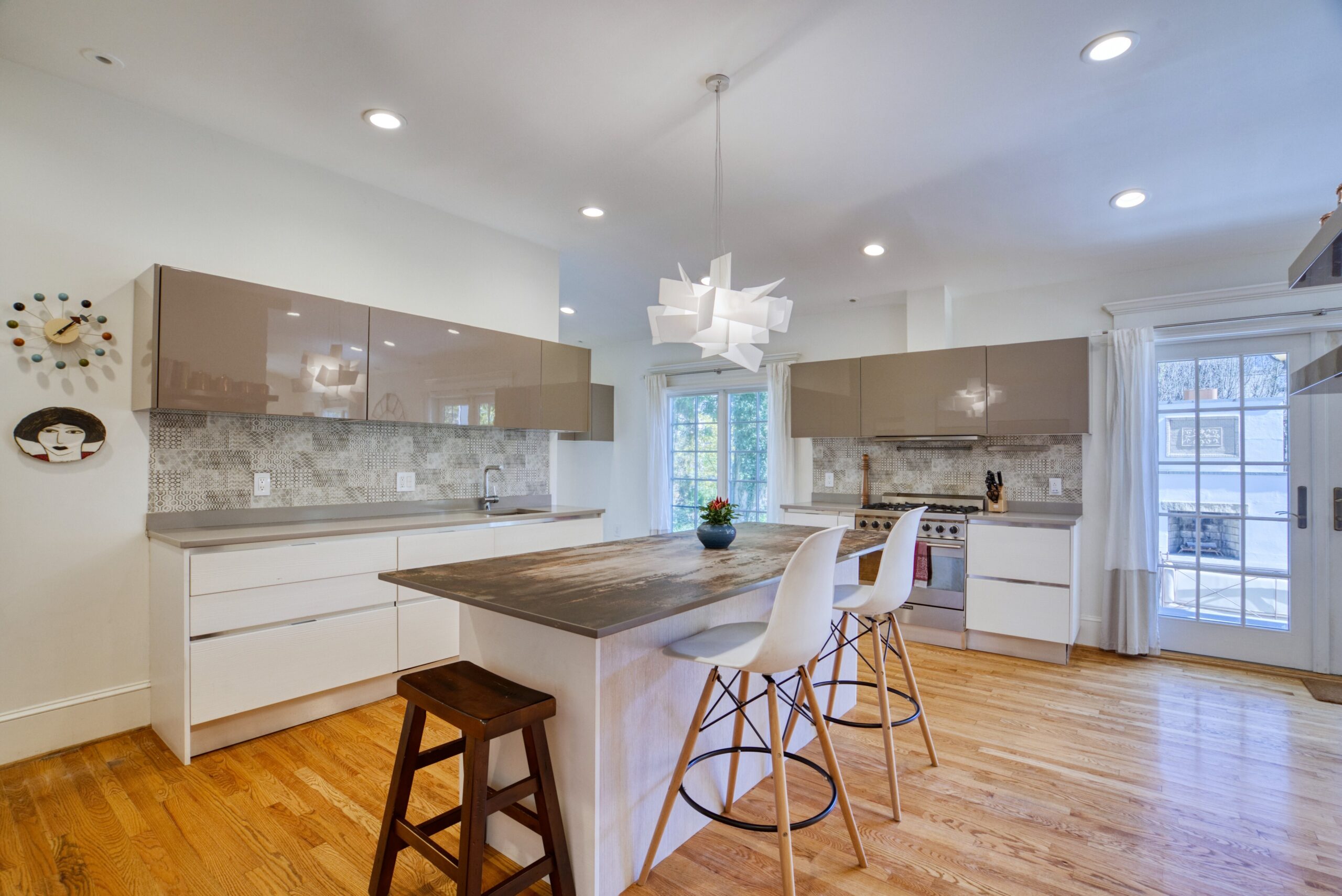 Interior professional photo of 1826 Varnum St NW - showing the kitchen with large island and barstools and very interesting cabinetry