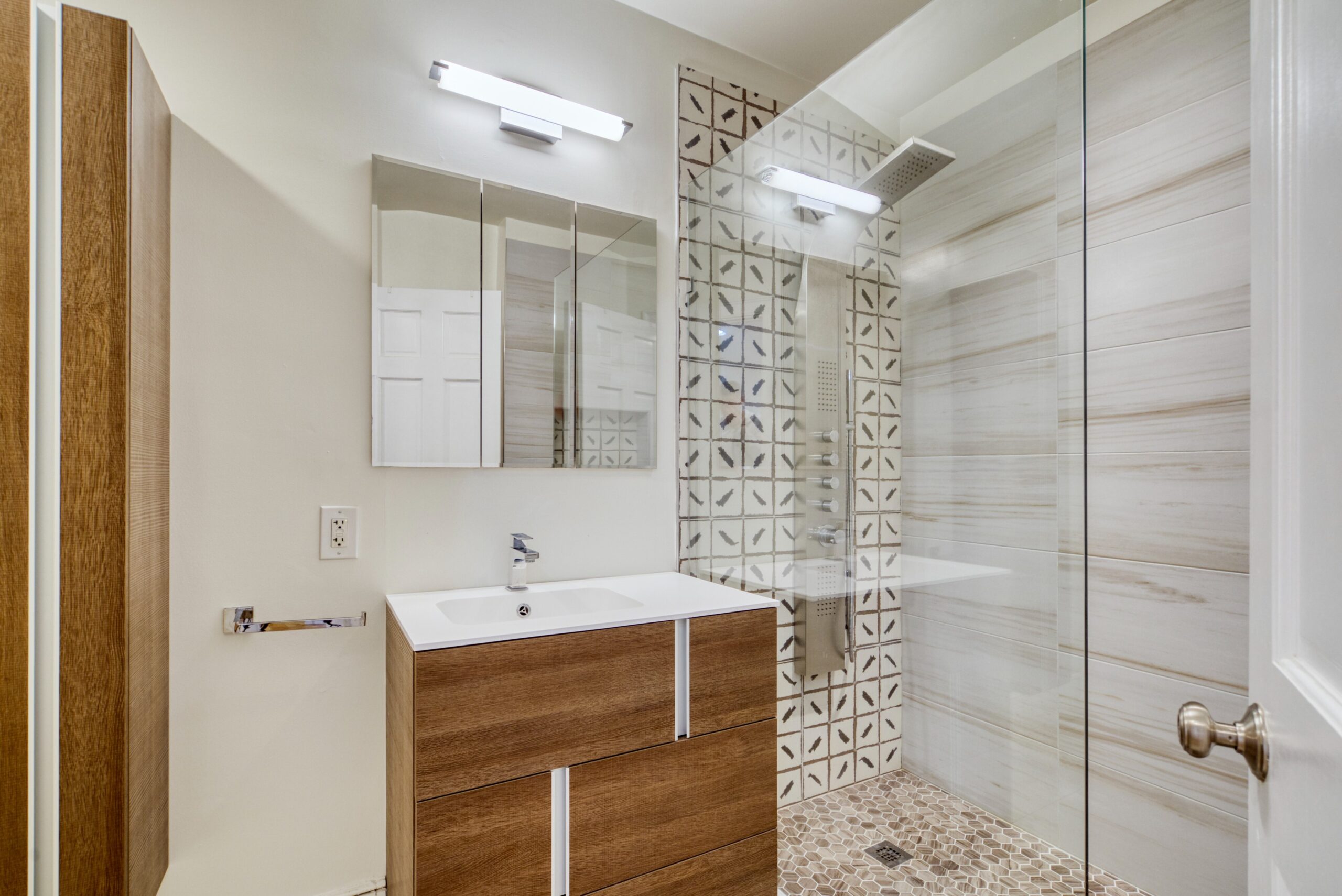 Interior professional photo of 1826 Varnum St NW - showing bathroom with interesting tilework in the shower