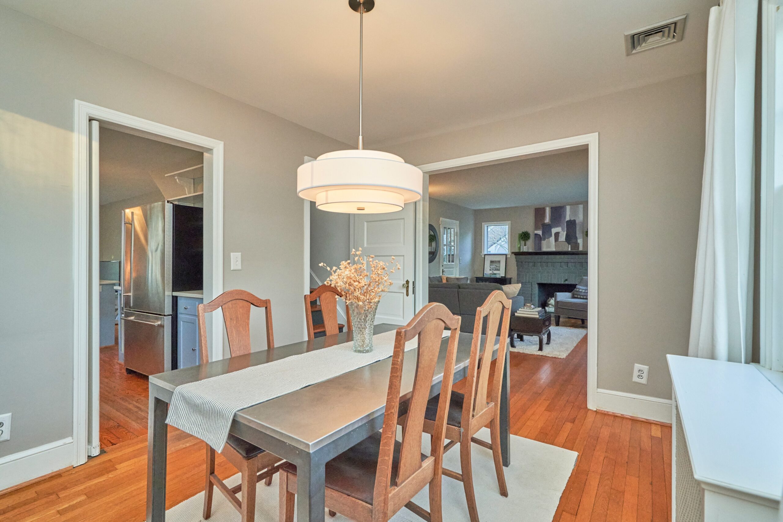 Professional interior photo of 5933 16th St N, Arlington, VA - showing the dining room with hardwood floors