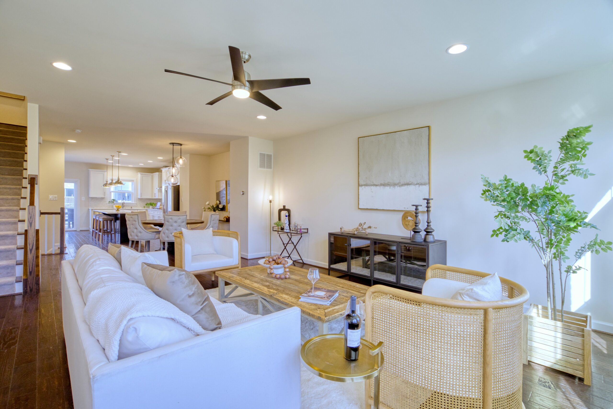 Professional interior photo of 3165 Virginia Bluebell Ct, Fairfax - showing the open living to dining space, with ceiling fan