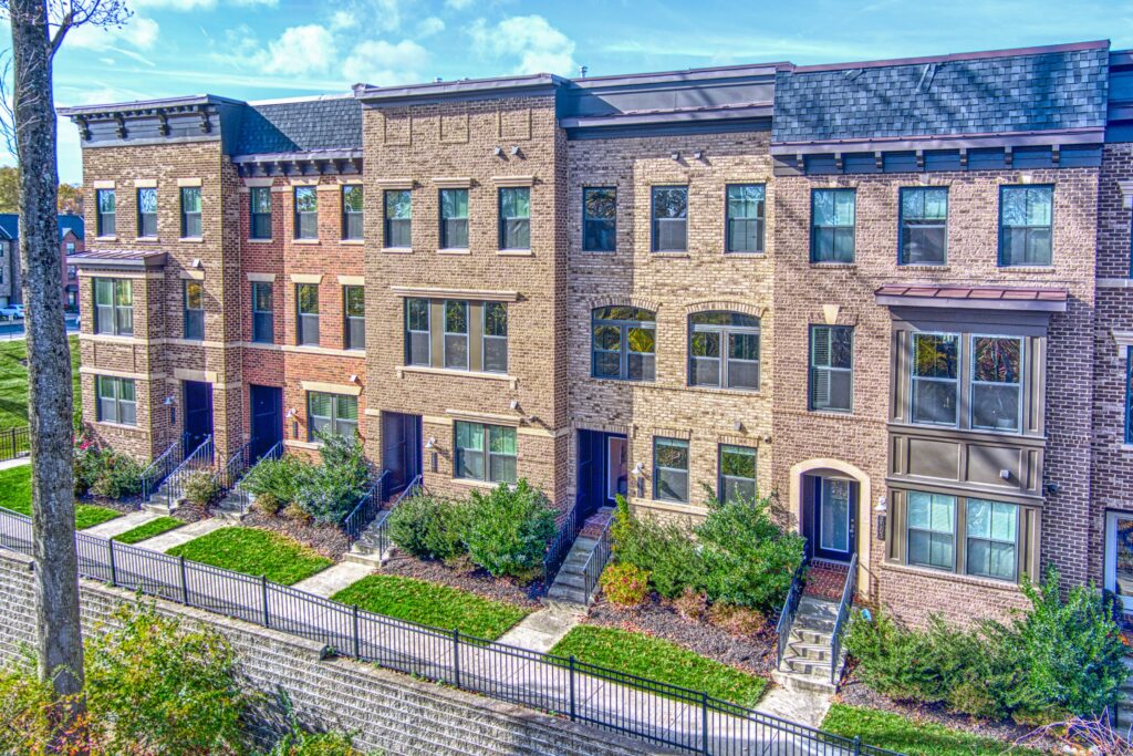 Professional exterior photo of 3165 Virginia Bluebell Ct, Fairfax - shot a low drown showing the line of 5 townhomes