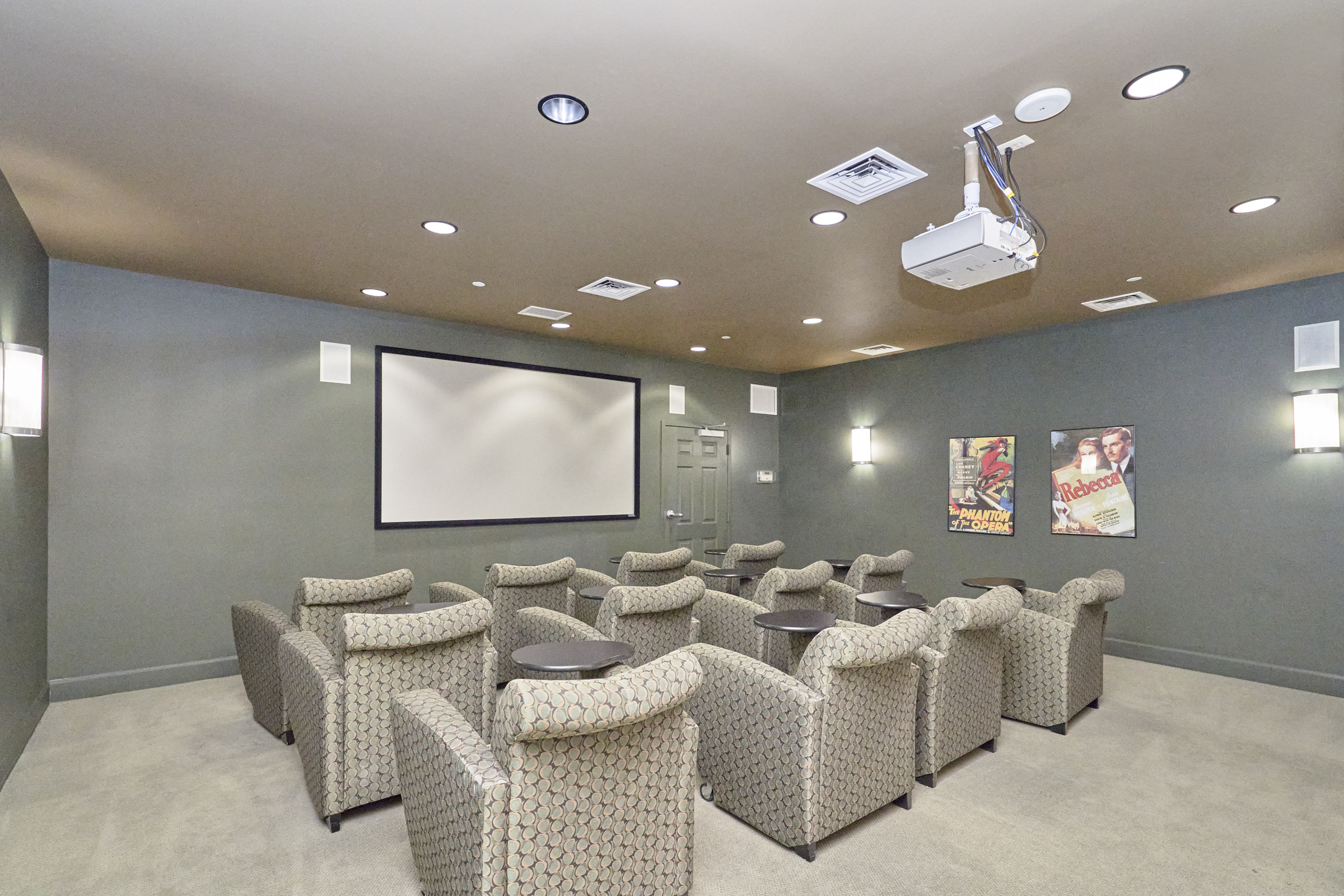 Interior professional photo of 11800 Sunset Hills Road, showing the private movie theater available to residents