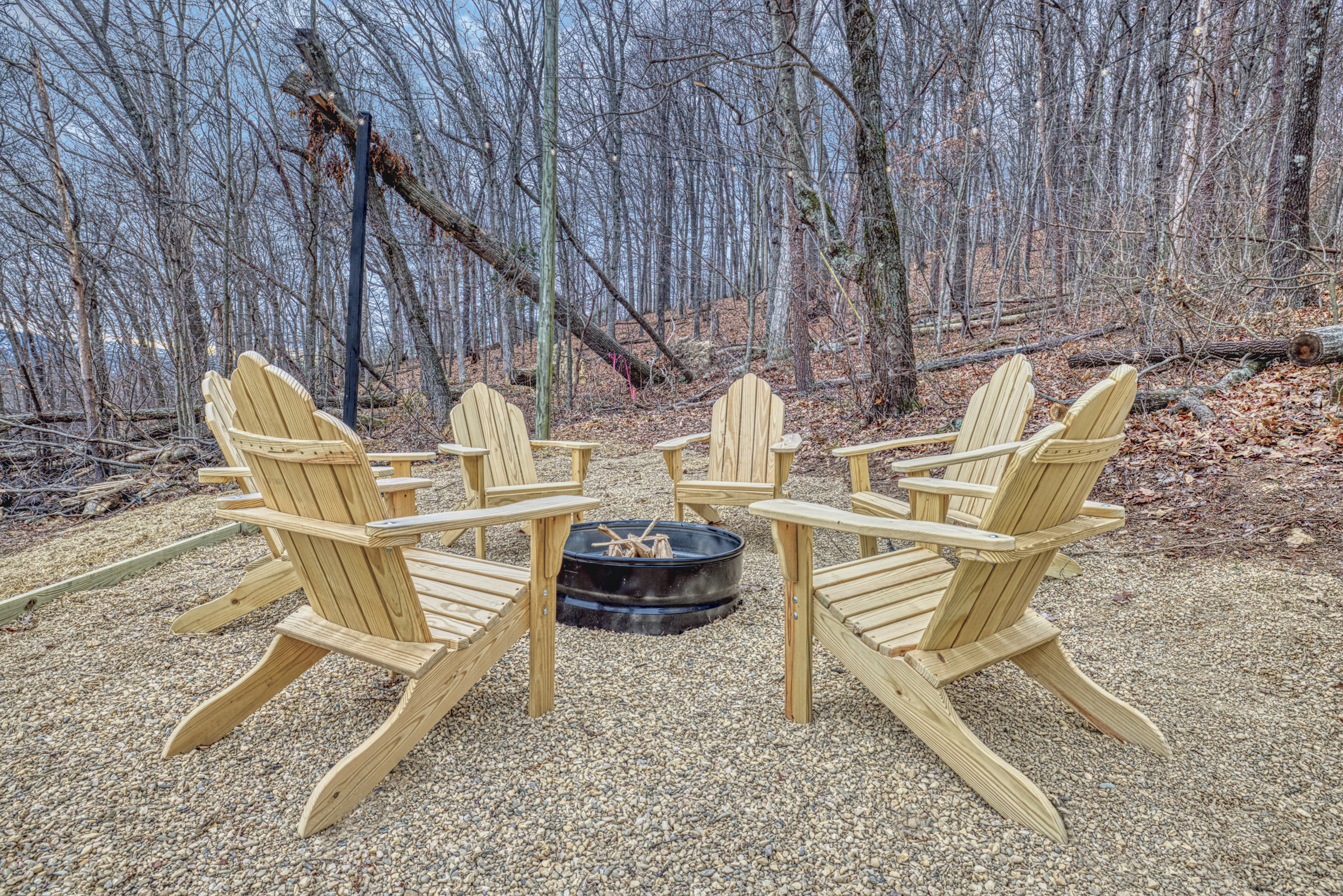 Professional exterior photo of 540 Pine Knob Road in Stanley, VA - showing fire pit and 6 adirondack chairs
