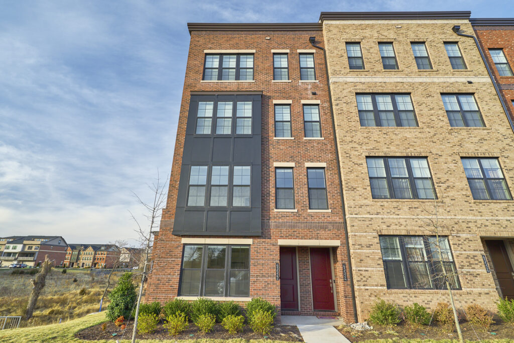 Exterior professional photo of 43522 Centergate Drive - showing the front head-on, brick front facade with 4 floors and lots of windows
