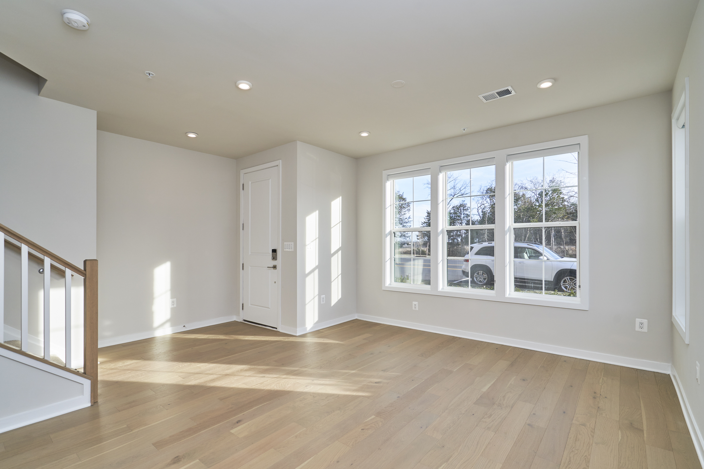 Interior professional photo of 43522 Centergate Drive - showing the main entrance and living room on the ground floor.