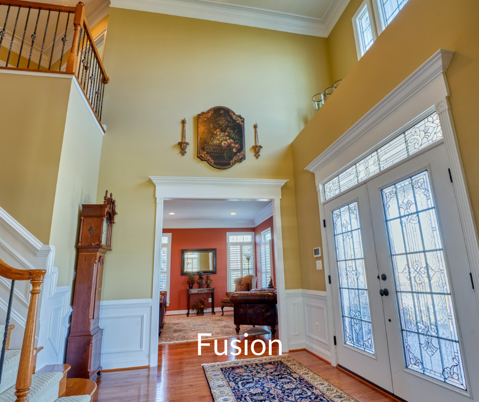 Professional Fusion photo of a 2-story foyer with hardwoods. Label "Fusion" overlay in white