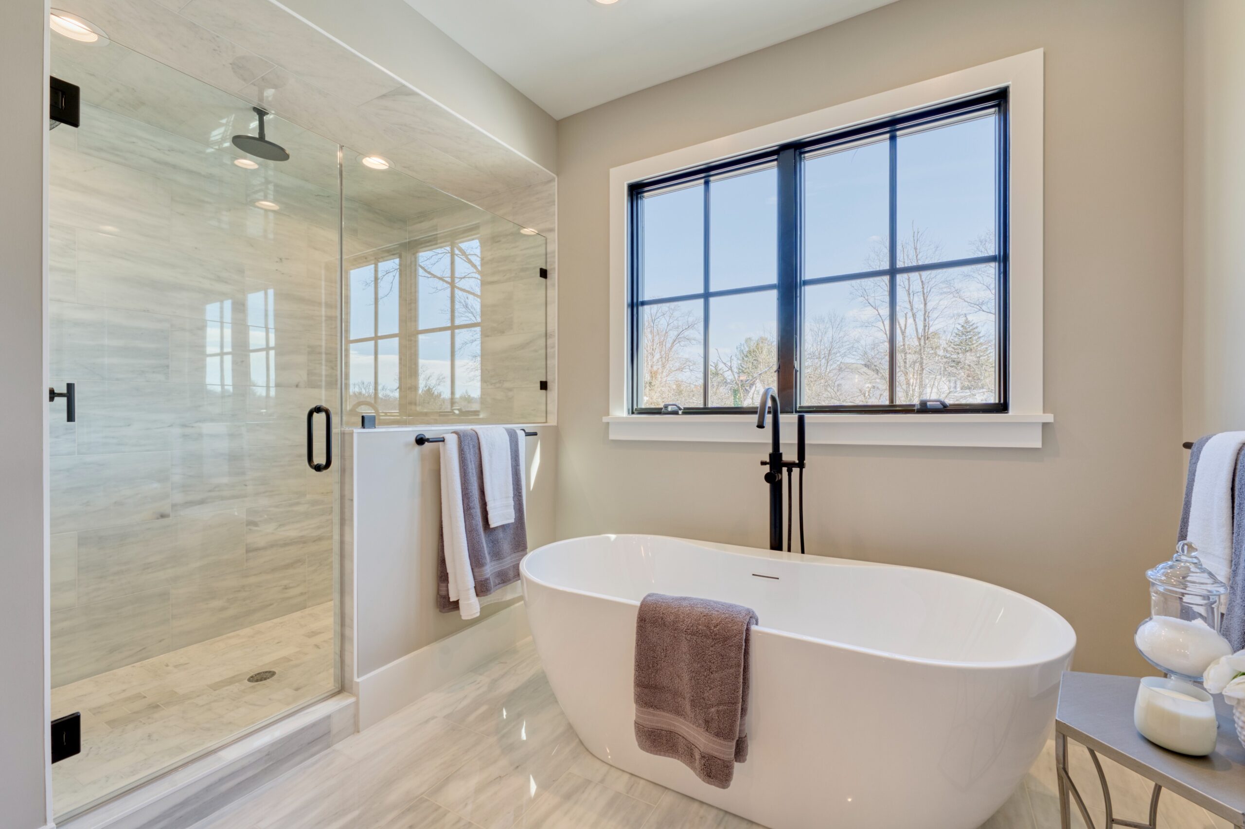 Professional interior photo of 1624 Dempsey St, McLean, VA - showing the primary bathroom with soaking tup and large zero entry shower with rainhead