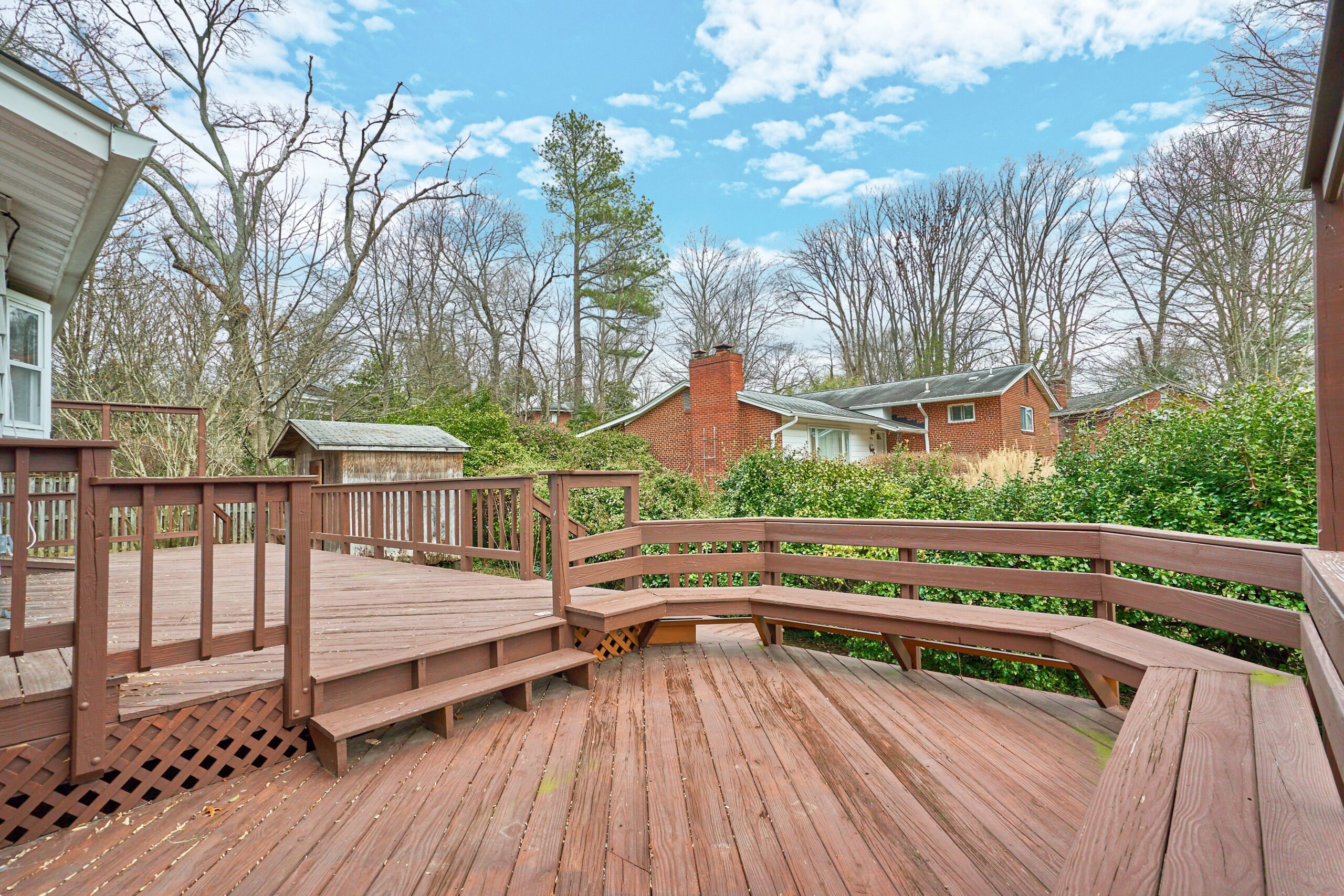 Professional exterior photo of 3482 Mildred Drive in Falls Church virginia, showing the rear deck with built-in wrap around bench