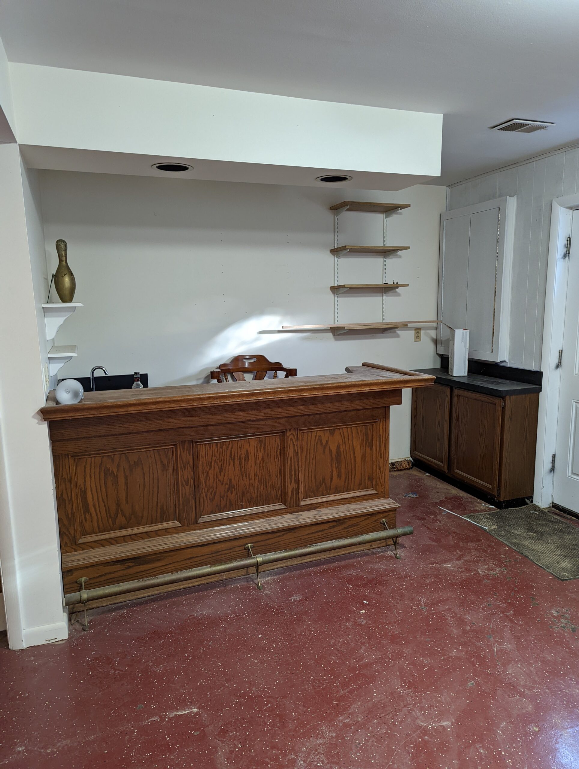 cellphone photo of 3482 Mildred Dr, Falls Church Virginia - showing the before photo of the basement corner bar