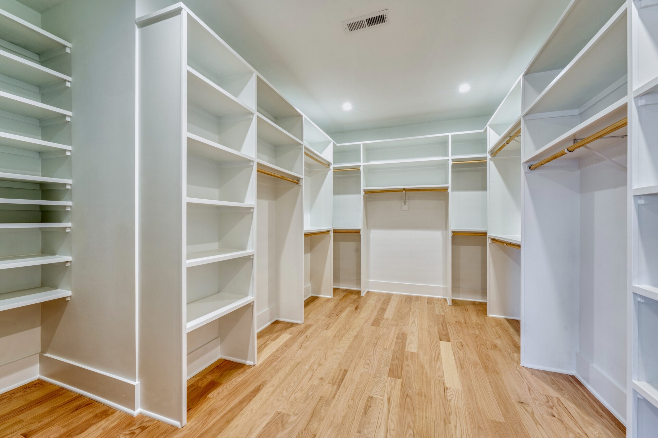 Professional interior photo of Custom New Home 1416 S Greenbrier St - showing the HUGE custom closet for the primary suite with multiple levels of shelving