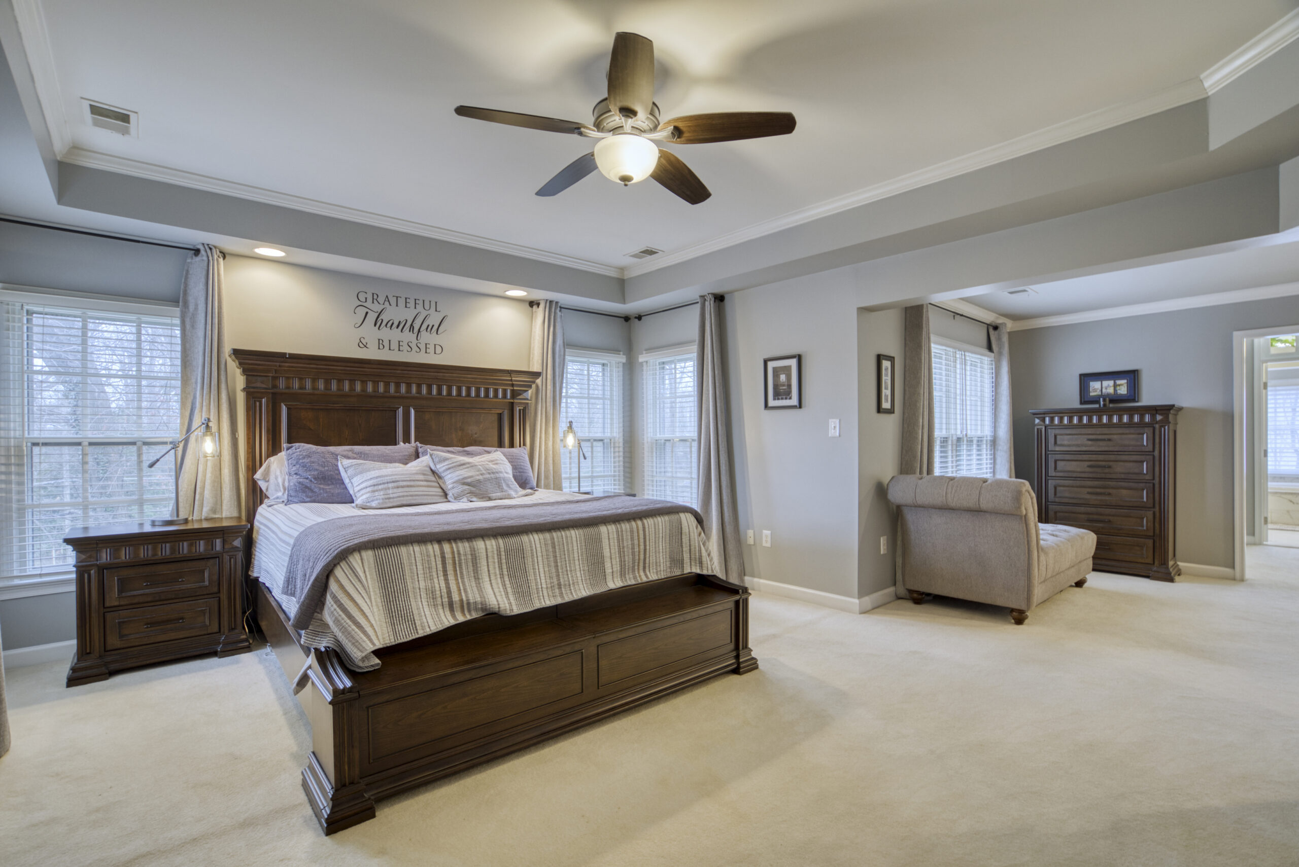 Professional interior photo of 9701 Chilcott Manor Way - showing the primary bedroom suite