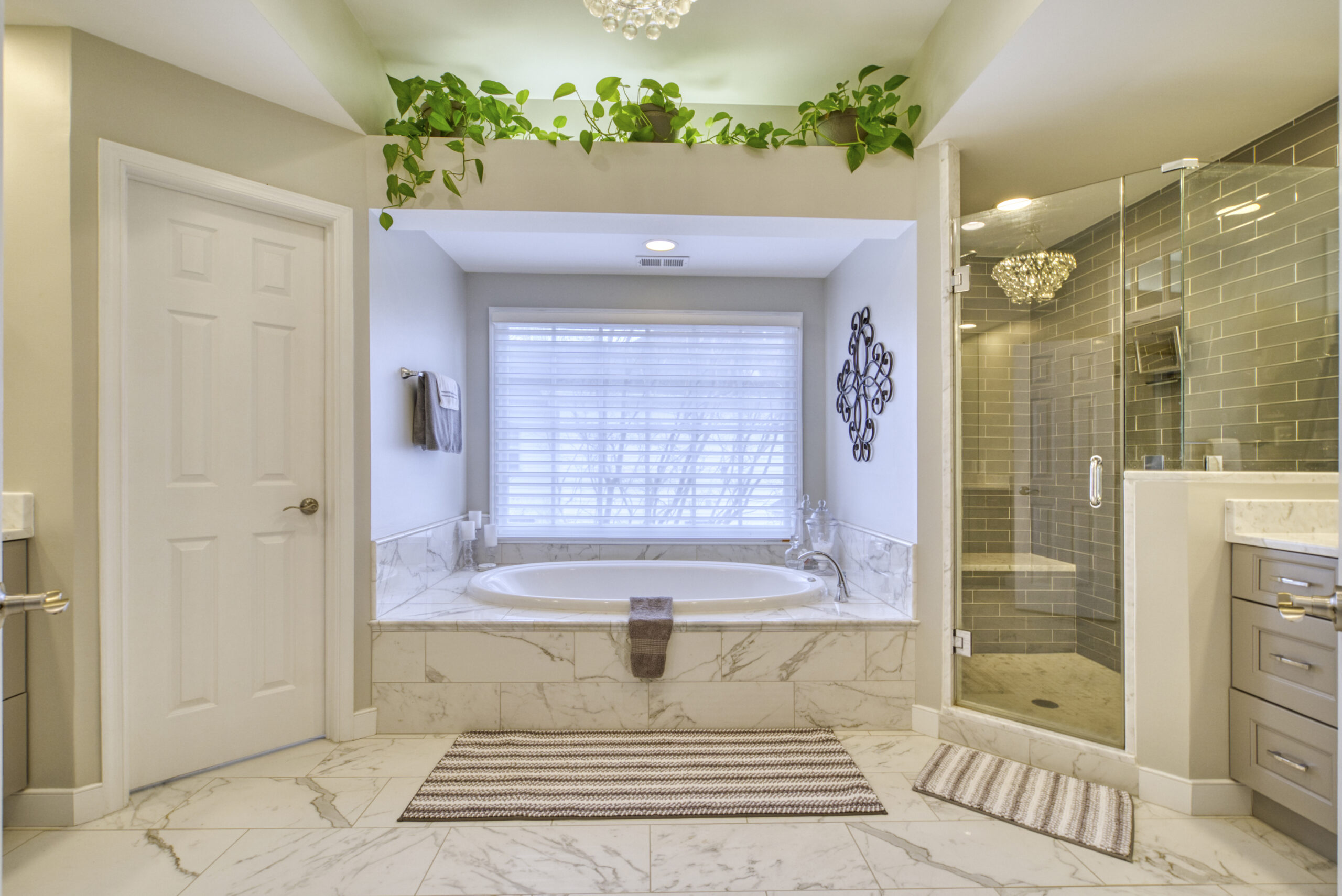 Professional interior photo of 9701 Chilcott Manor Way - showing the primary bathroom with soaking tub and large shower