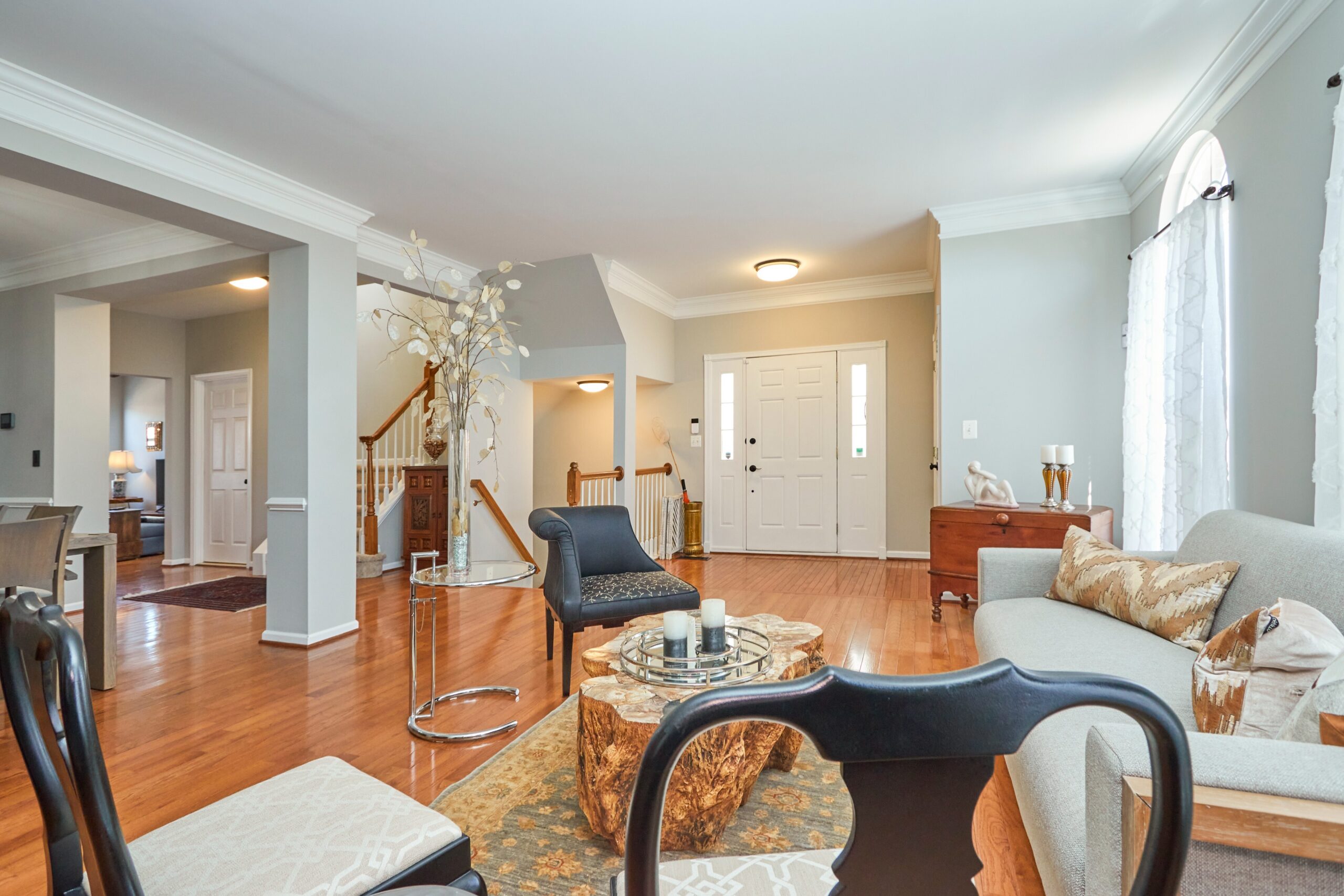 Professional interior photo of 25499 Beresford Drive, Chantilly, Virginia - showing the living room on the main level with hardwood floors