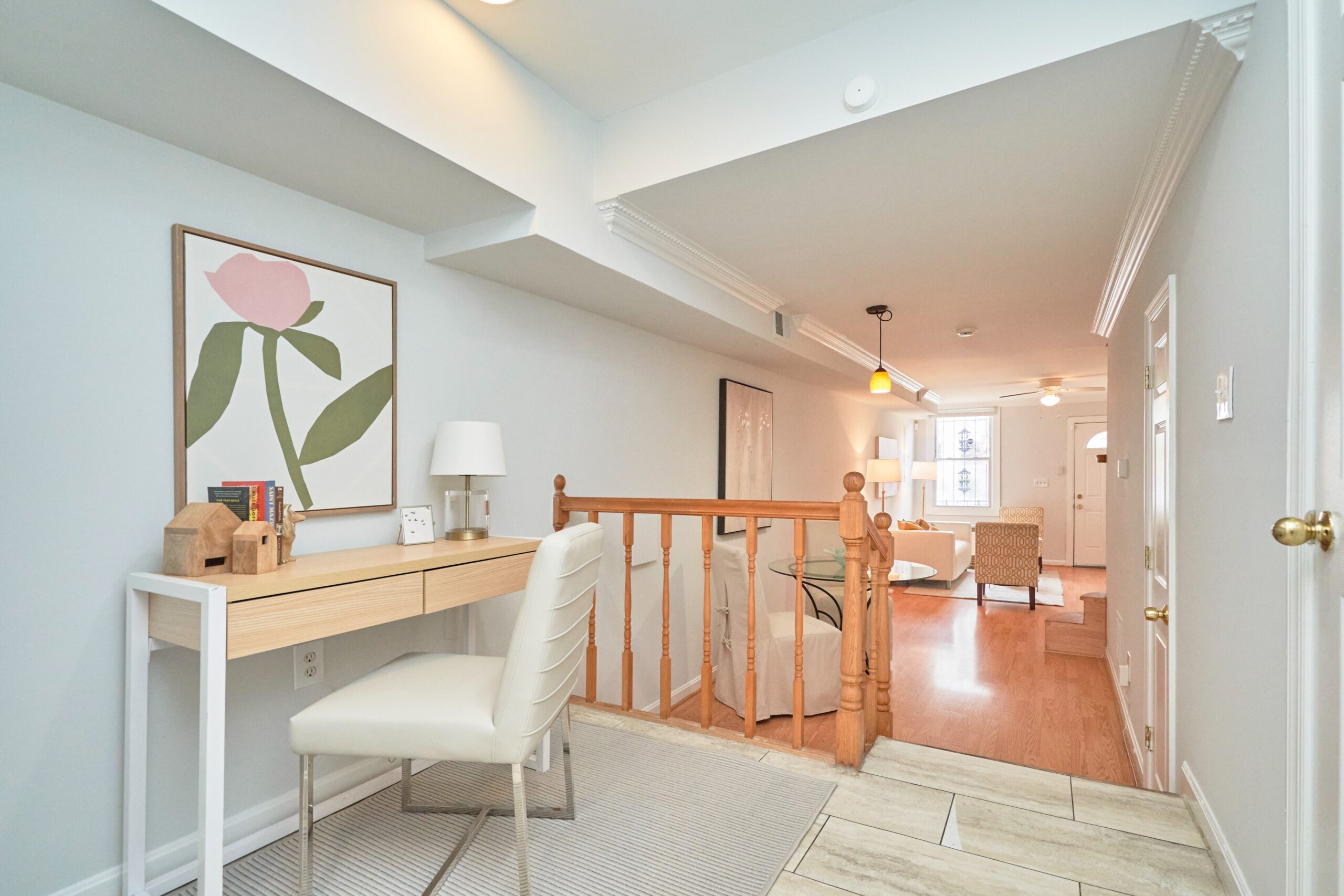 Professional interior photo of 1313 K Street SE, Washington, DC - showing the office space and 2 steps down to the breakfast/dining area and the front living room