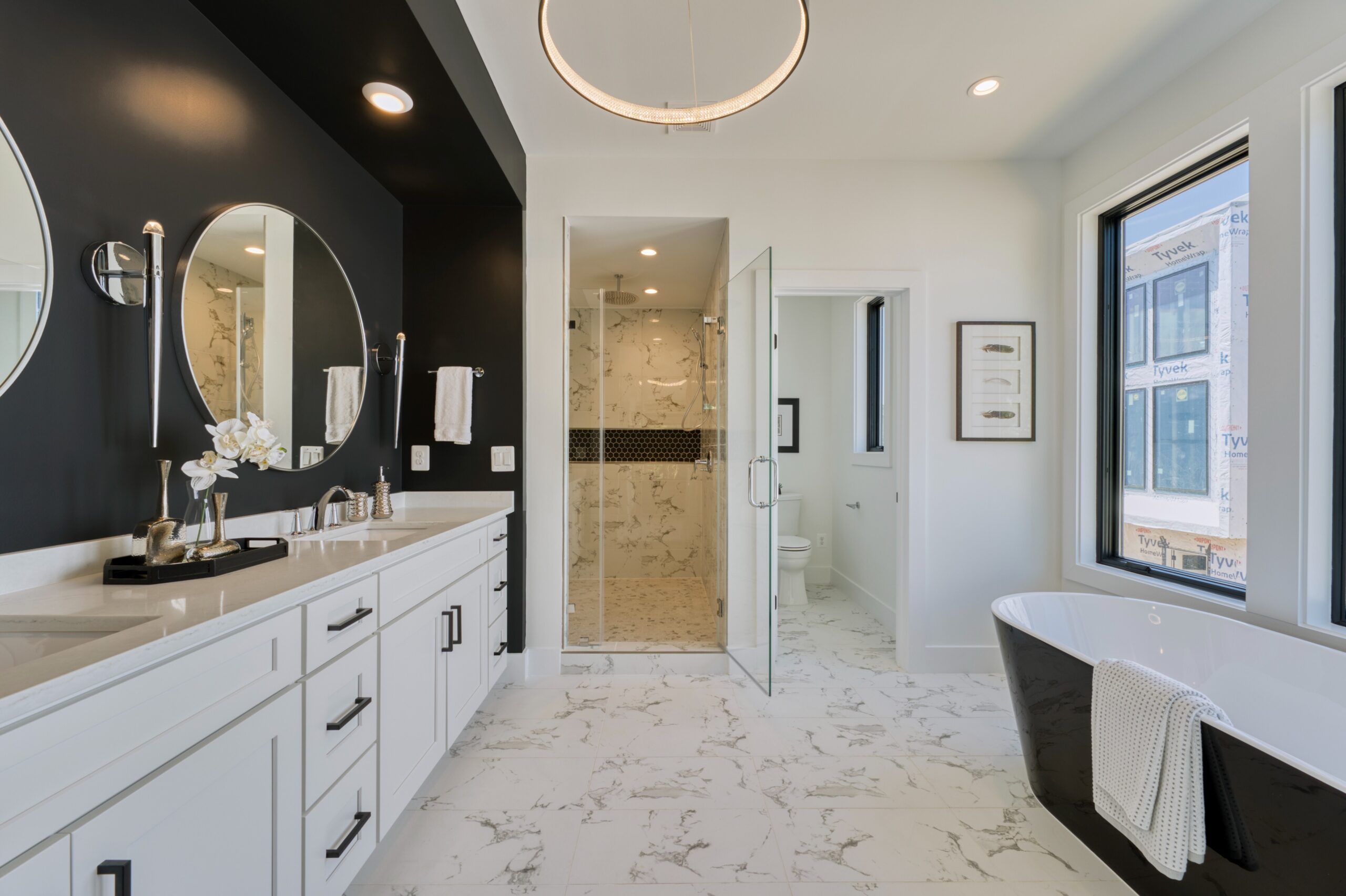 Professional interior photo of 1137 Buchanan St in McLean, VA - showing the primary bathroom finished in white quartz with soaking tub, commode room, and separate shower room