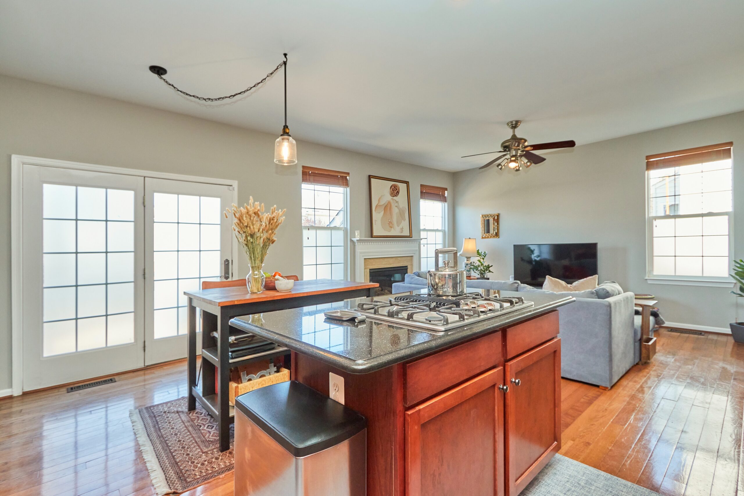 Professional interior photo of 25499 Beresford Drive, Chantilly, Virginia - showing the view when standing in the kitchen looking towards the family room area