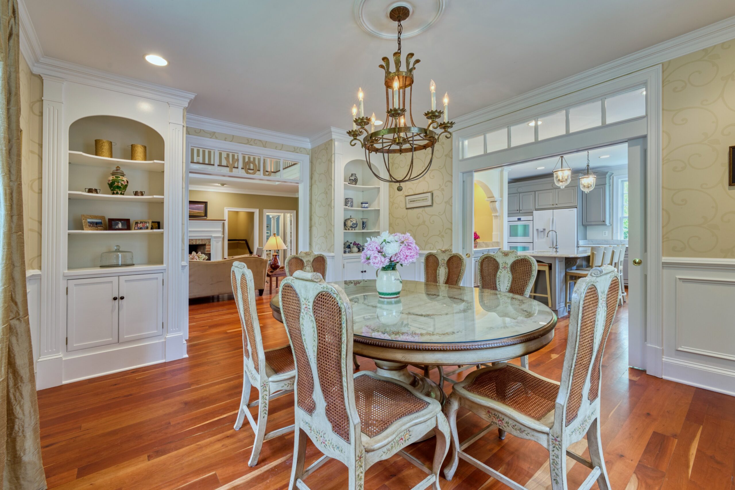 Professional interior photo of 15203 Clover Hill Road - showing the formal dining room with chandelier and cherry floors