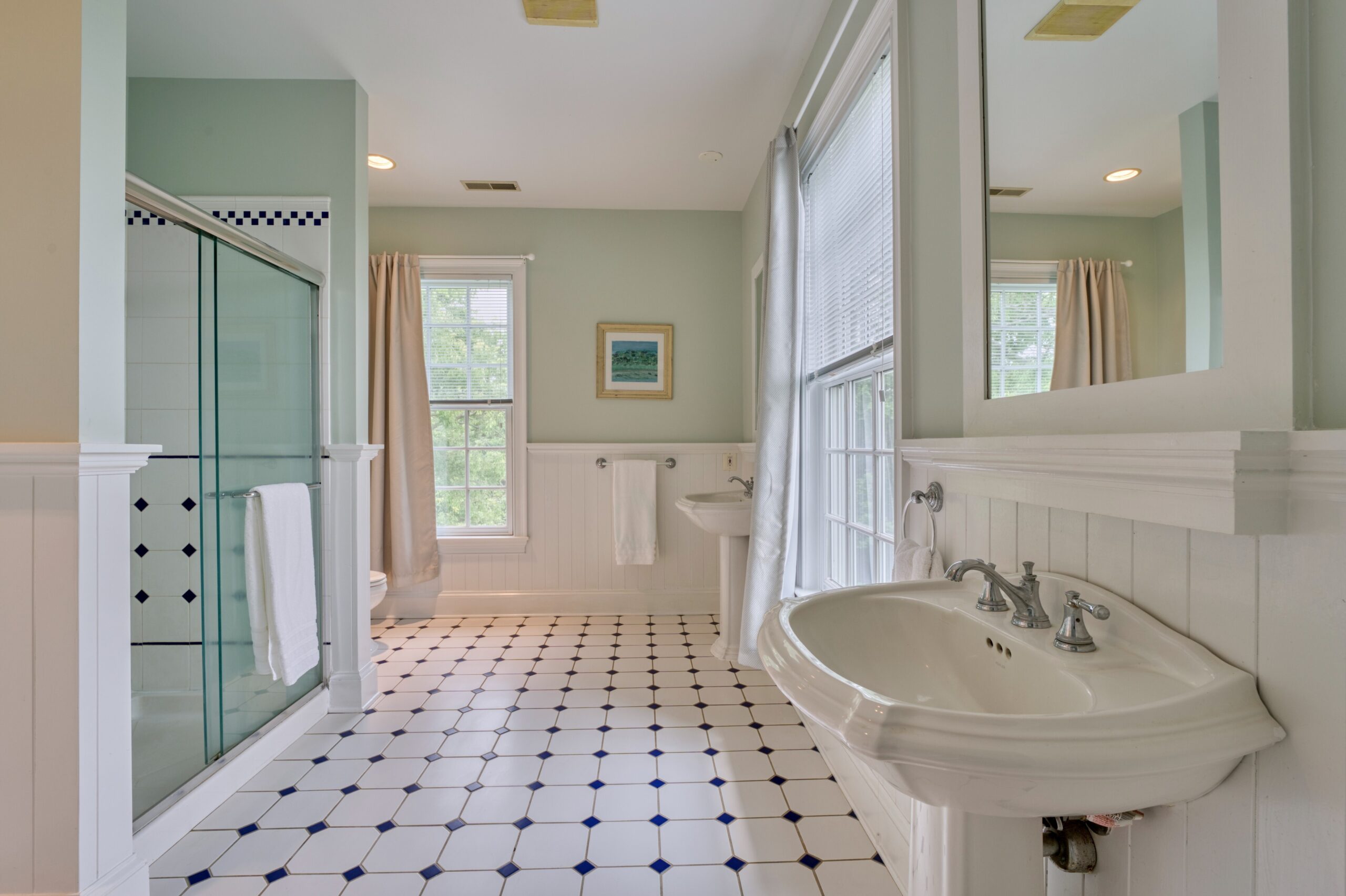 Professional interior photo of 15203 Clover Hill Road - showing the primary bathroom with black and white tile floors