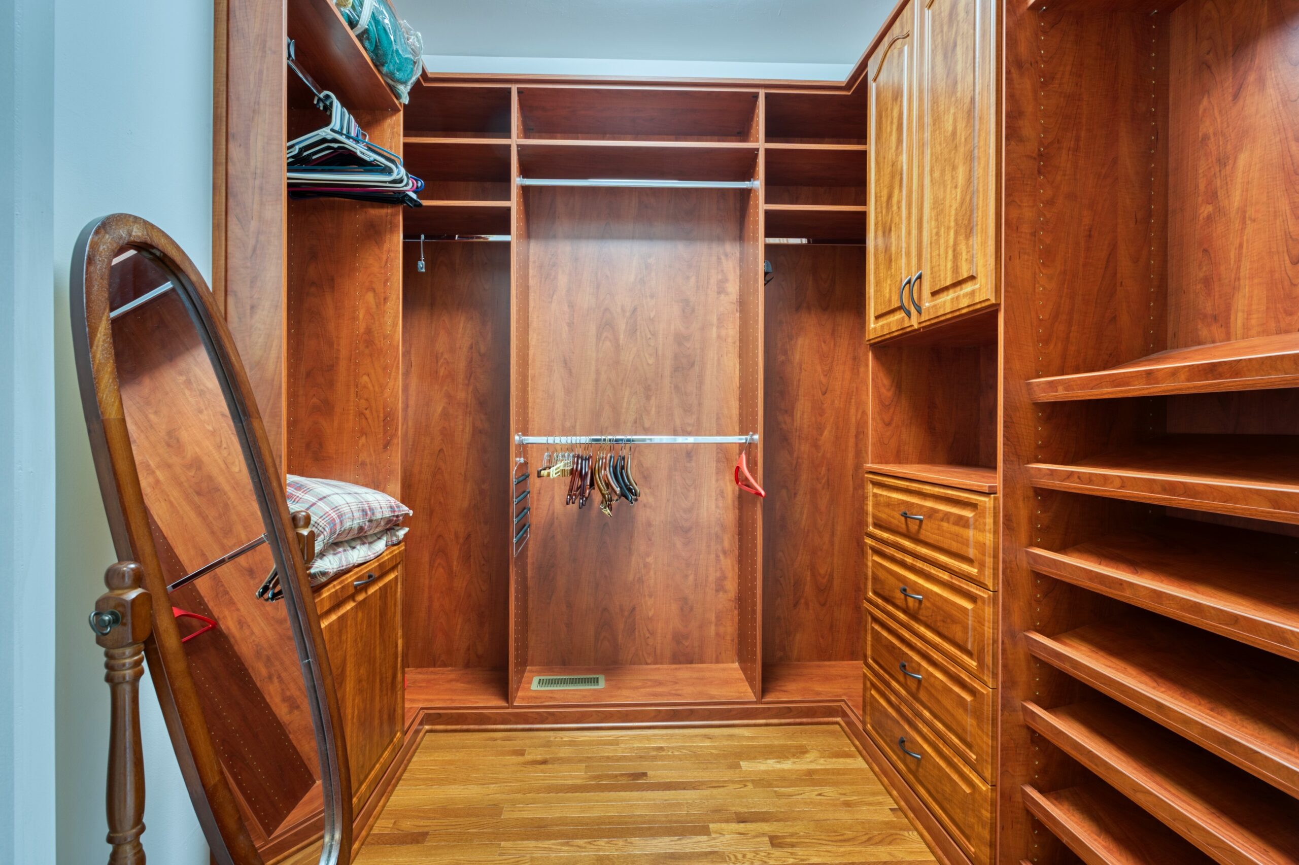 Professional interior photo of 13700 Holly Forest Dr - showing the master walkin closet which is custon built of solid oak