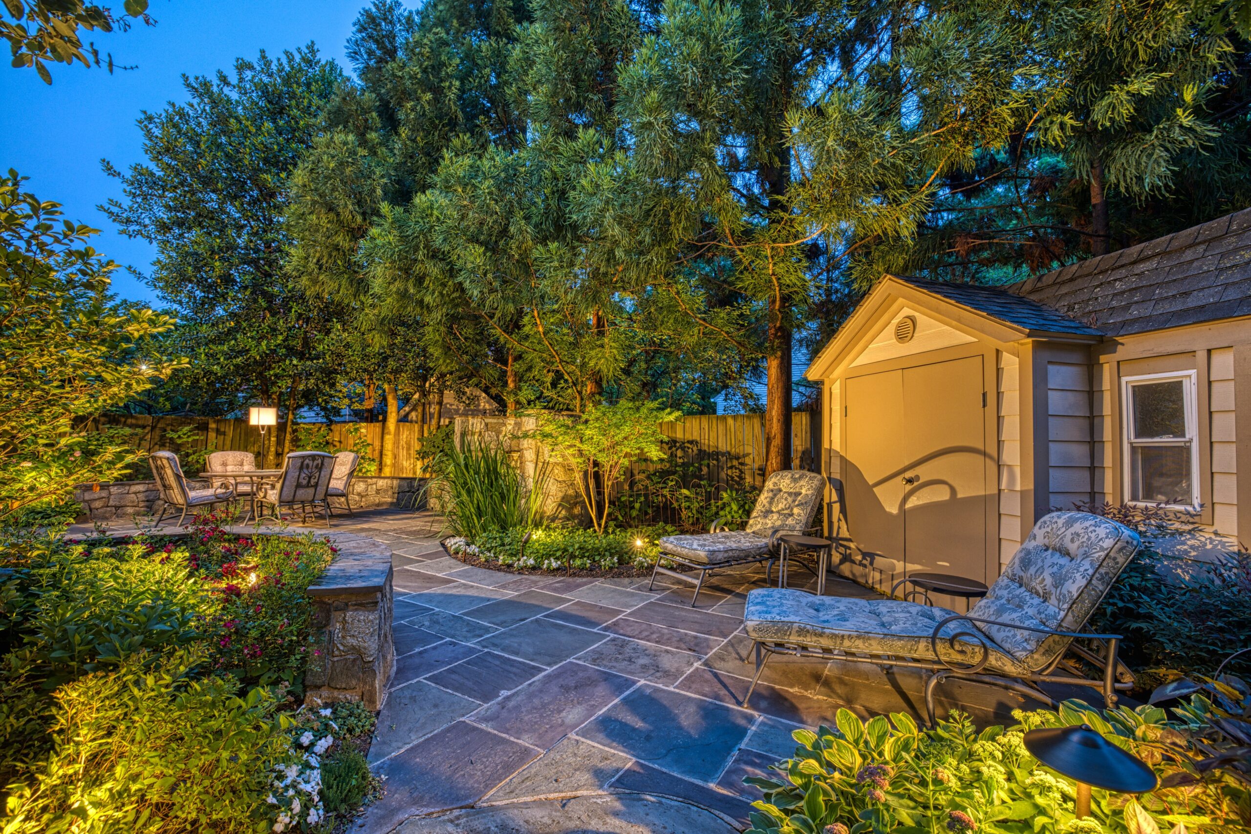 Professional exterior photo taken at dusk of 819 N Fillmore St - Showing the rear of the home looking along the flagstone patio