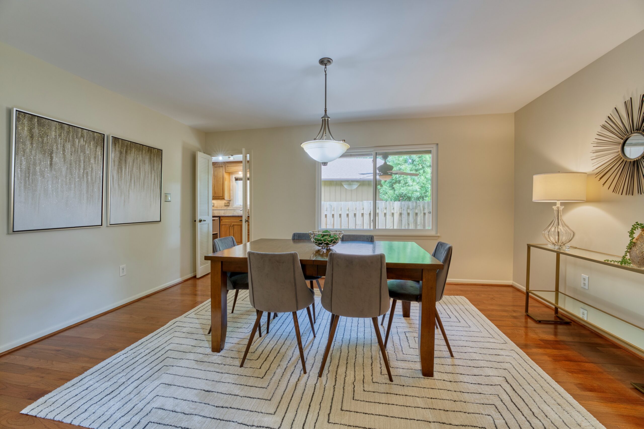 Professional interior photo of 5222 Bradfield Dr in Burke, Virginia - showing the dining room with hardwood floors