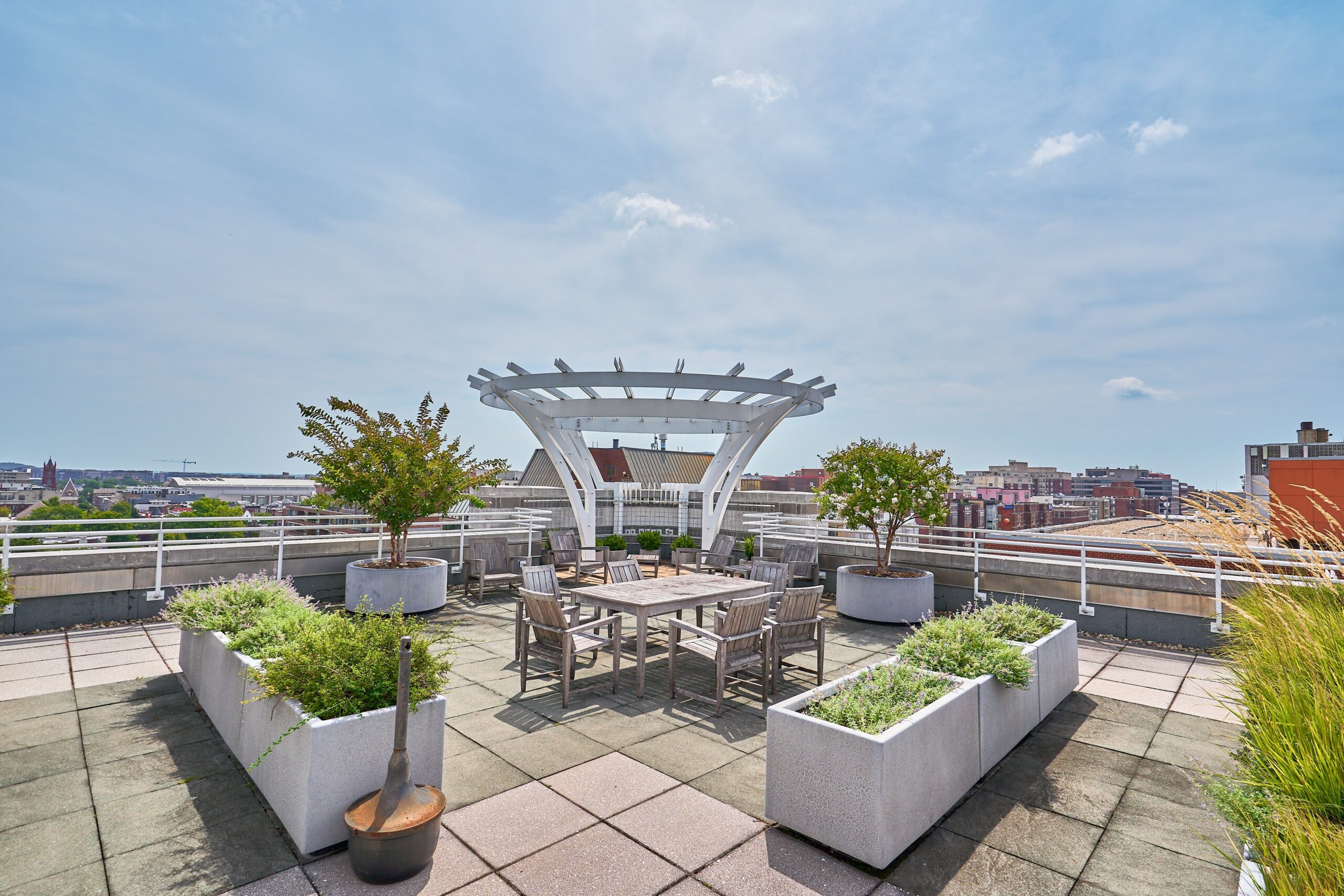 Professional exterior photo of 1300 13th St NW #102, Washington DC - showing the rooftop terrace