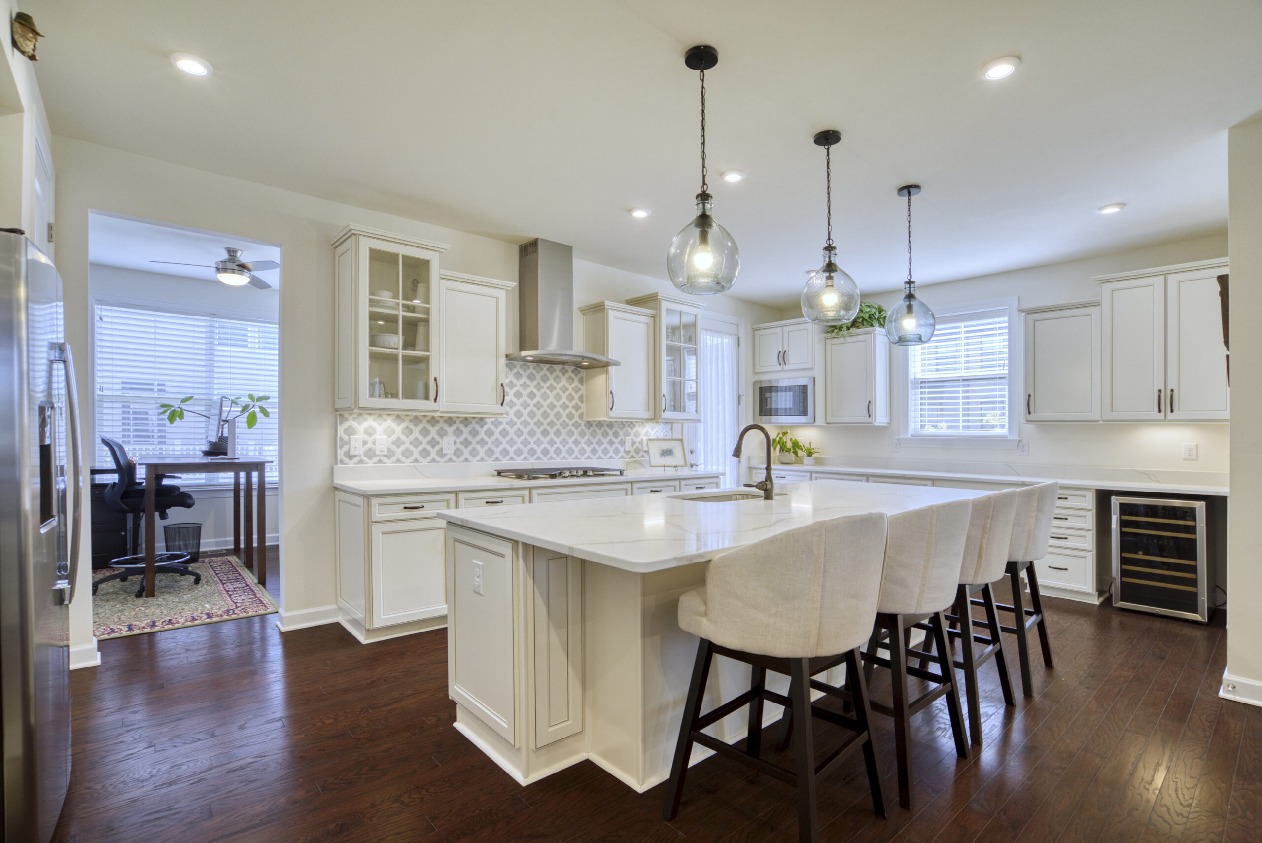 Professional interior photo of 8109 Zoe Place, Alexandria, VA - Showing the kitchen with large quartz island