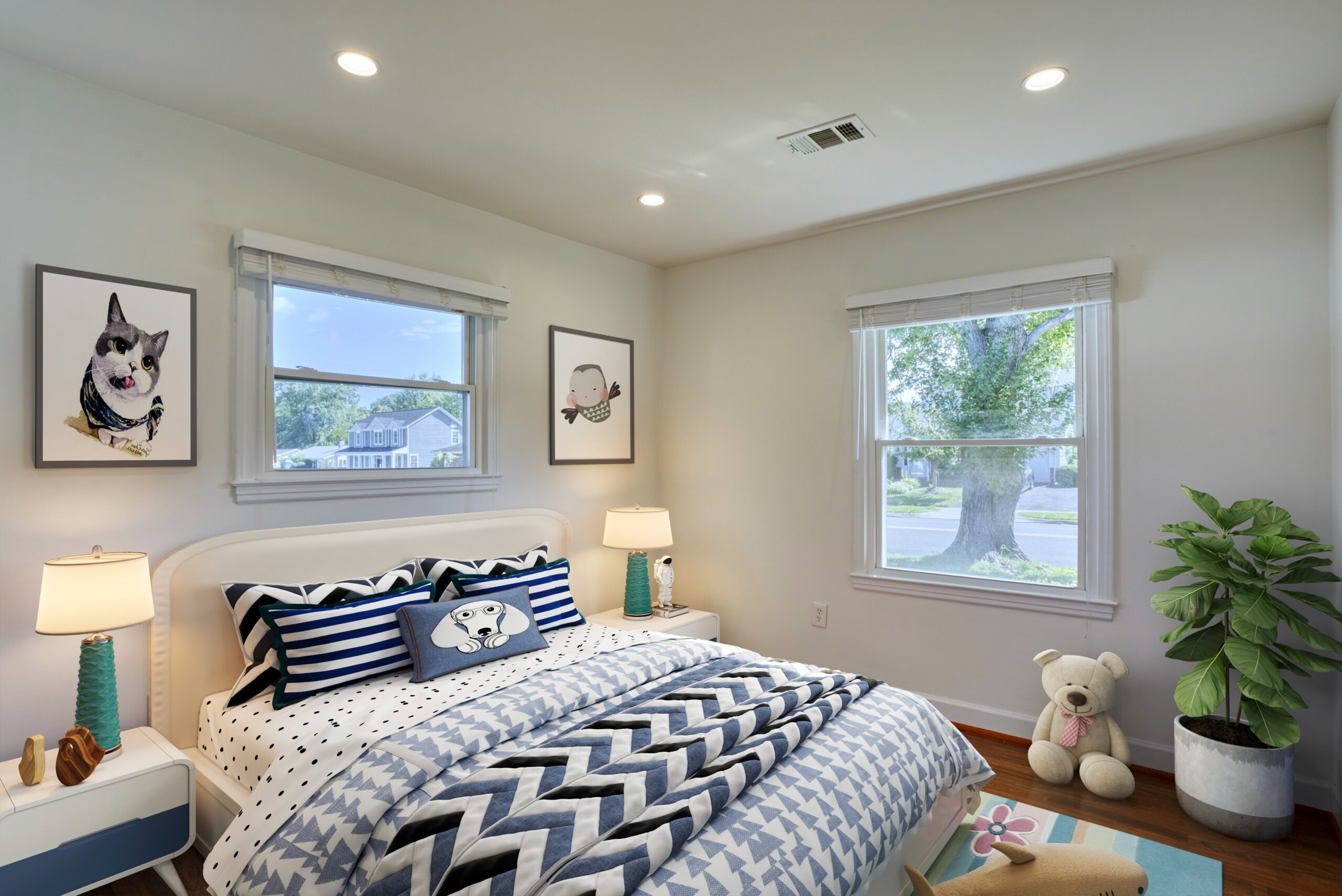 Professional interior photo of 1103 S Greenthorn Ave in Sterling, VA - showing a bedroom with hardwood floors and two windows which has been virtually staged as a bedroom 