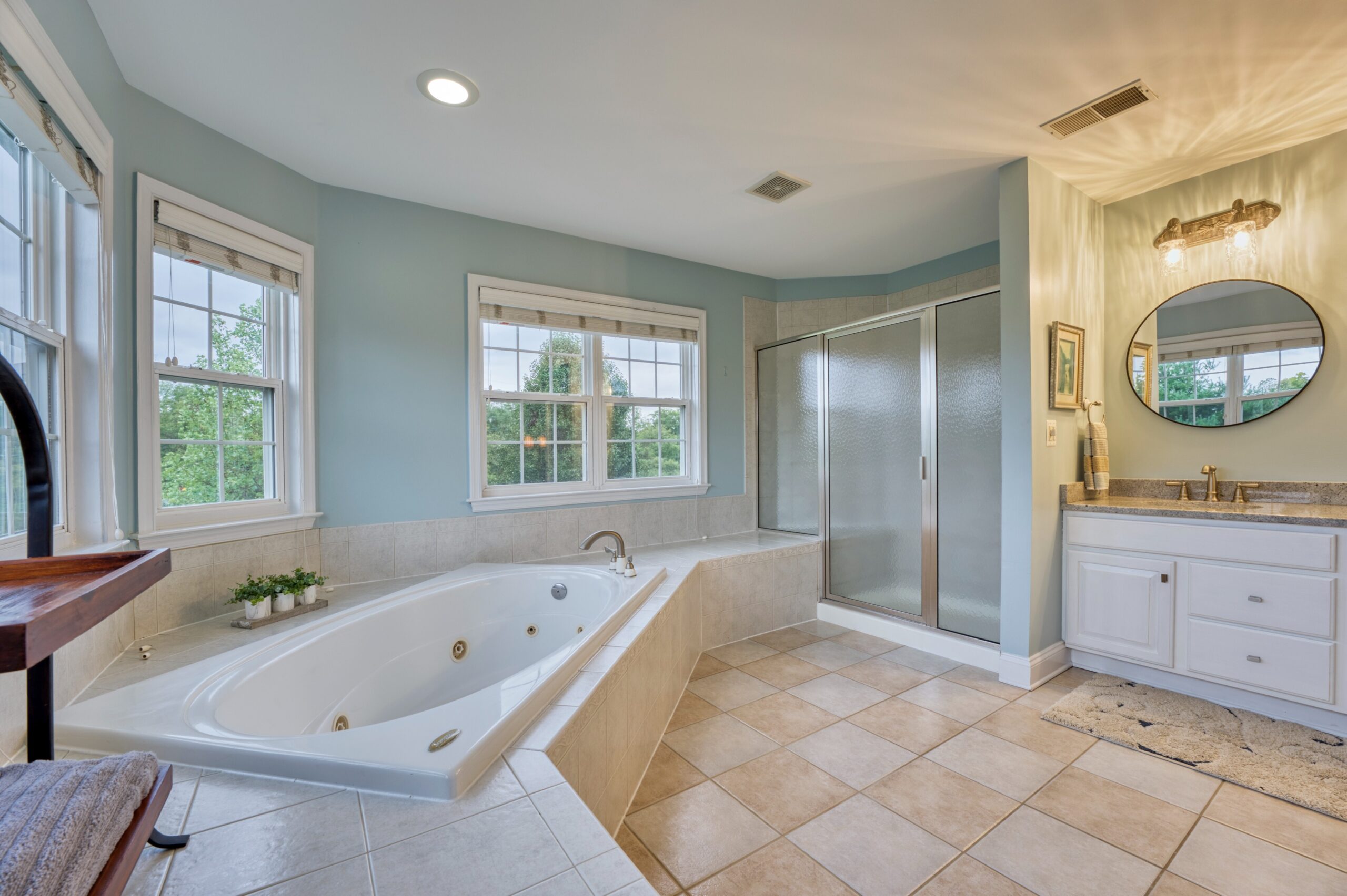 Professional interior photo of 16961 Heather Knolls Pl - showing the primary bathroom with large jacuzzi tub, large shower and double vanity