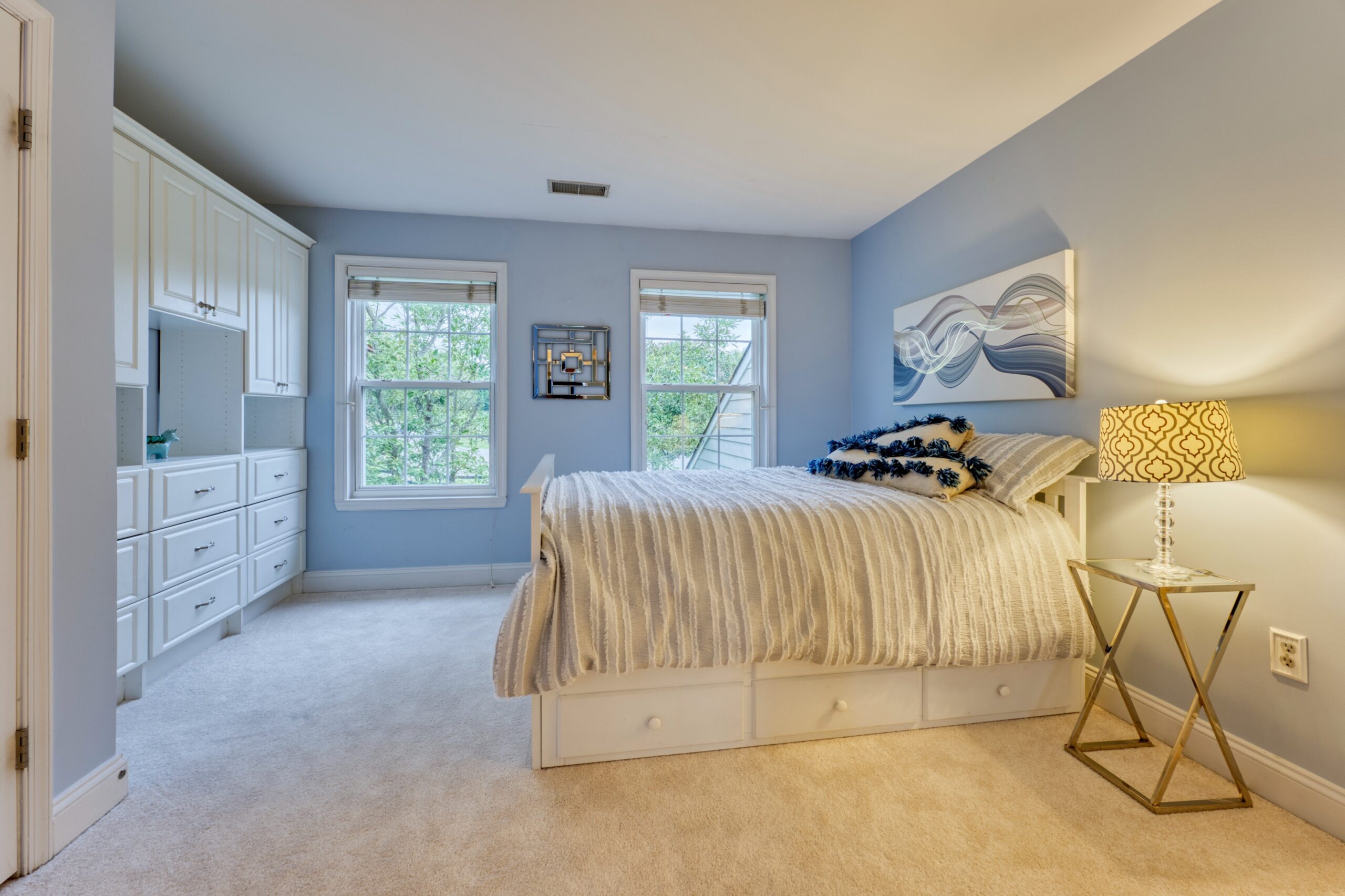Professional interior photo of 16961 Heather Knolls Pl - showing a secondary bedroom with built-in cabinets and storage