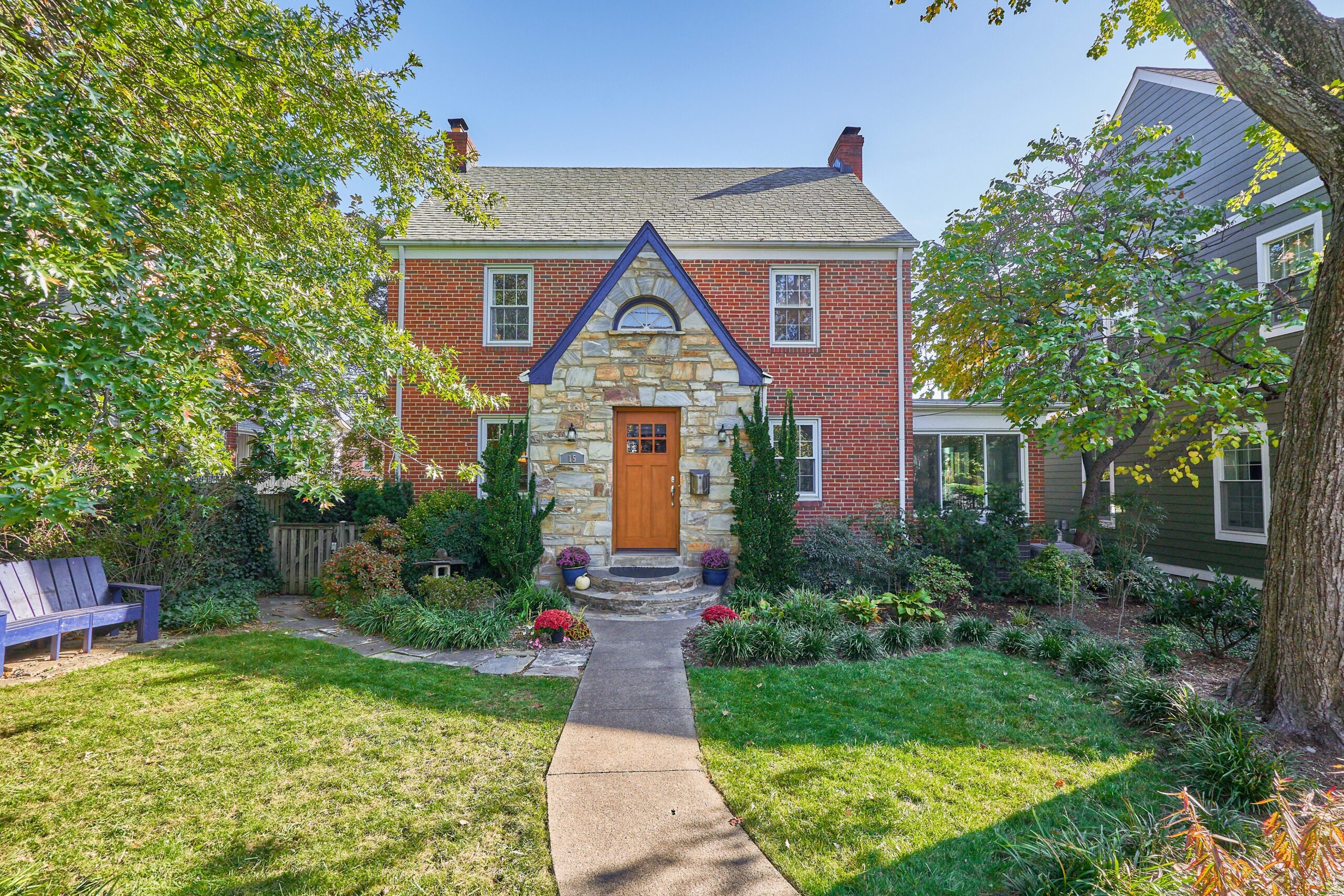 Professional exterior photo of 15 N Fenwick Street - showing front walkway to the front door, stone portico in front of a brick colonial