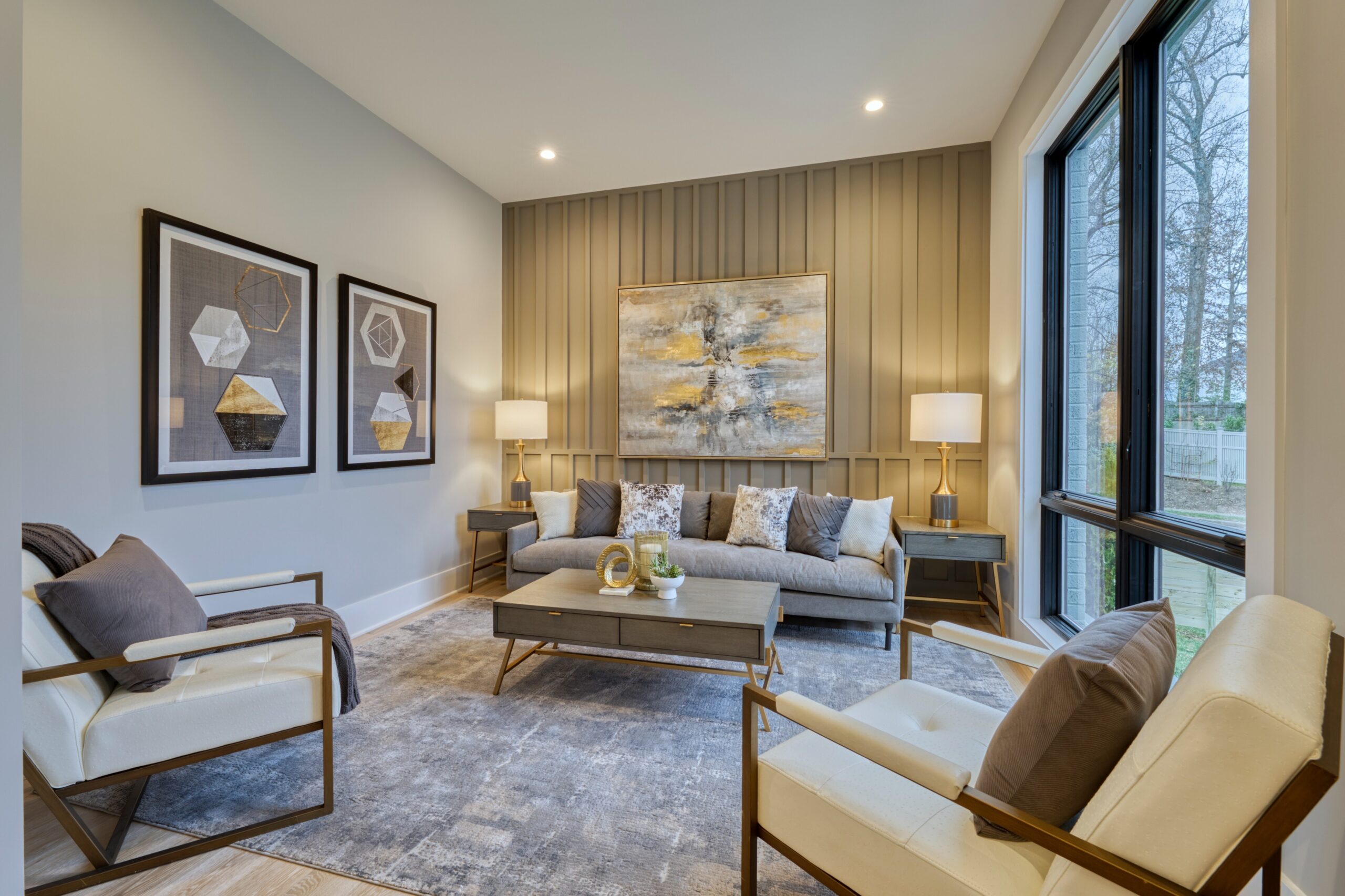 Professional interior photo of new construction home at 3400 N Ohio St - showing the front formal living room with accent wall and floor to ceiling windows