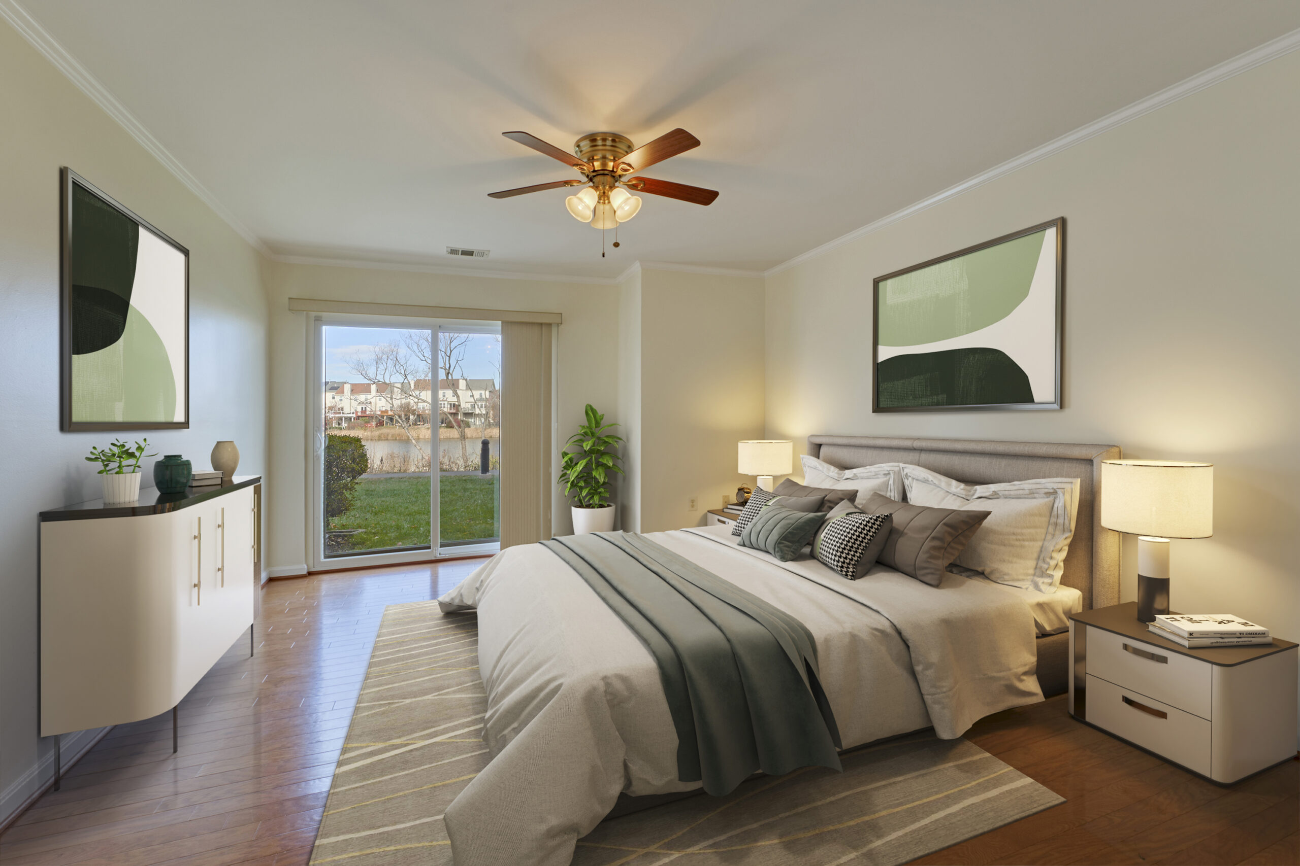Professional interior photo of 20588 Cornstalk Ter Unit 101 - Showing the bedroom for one of the primary suites with hardwood floors, which has been virtually staged