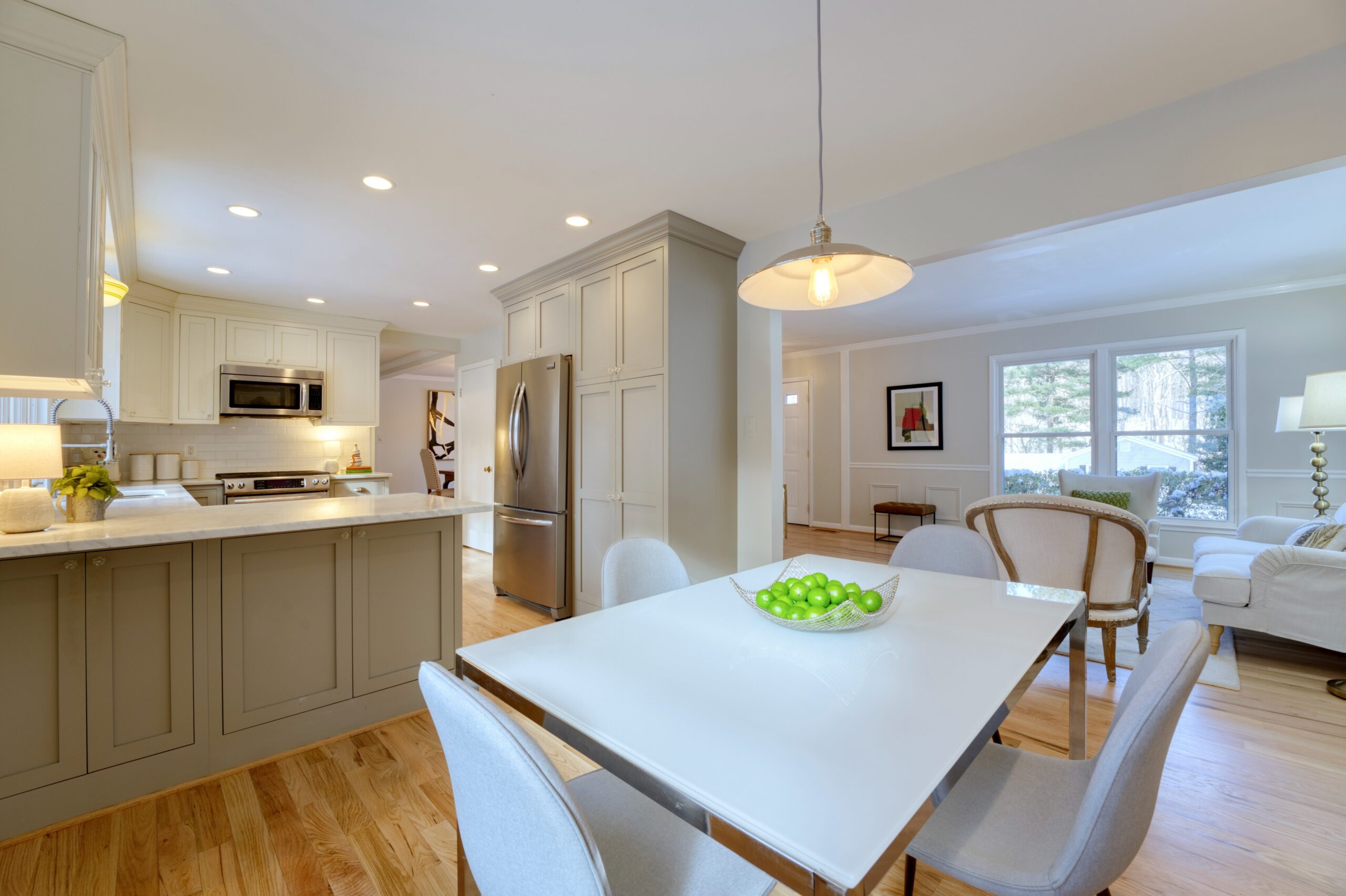 Professional interior photo of 9515 Center St in Vienna, Virginia - showing the kitchen in the background behind the kitchen eating area