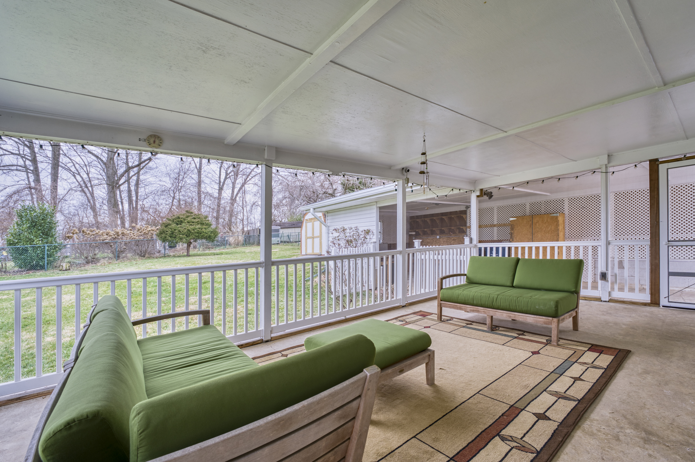 Professional interior photo of 2624 Depaul Dr in Vienna, VA - showing the screened porch looking over the flat backyard