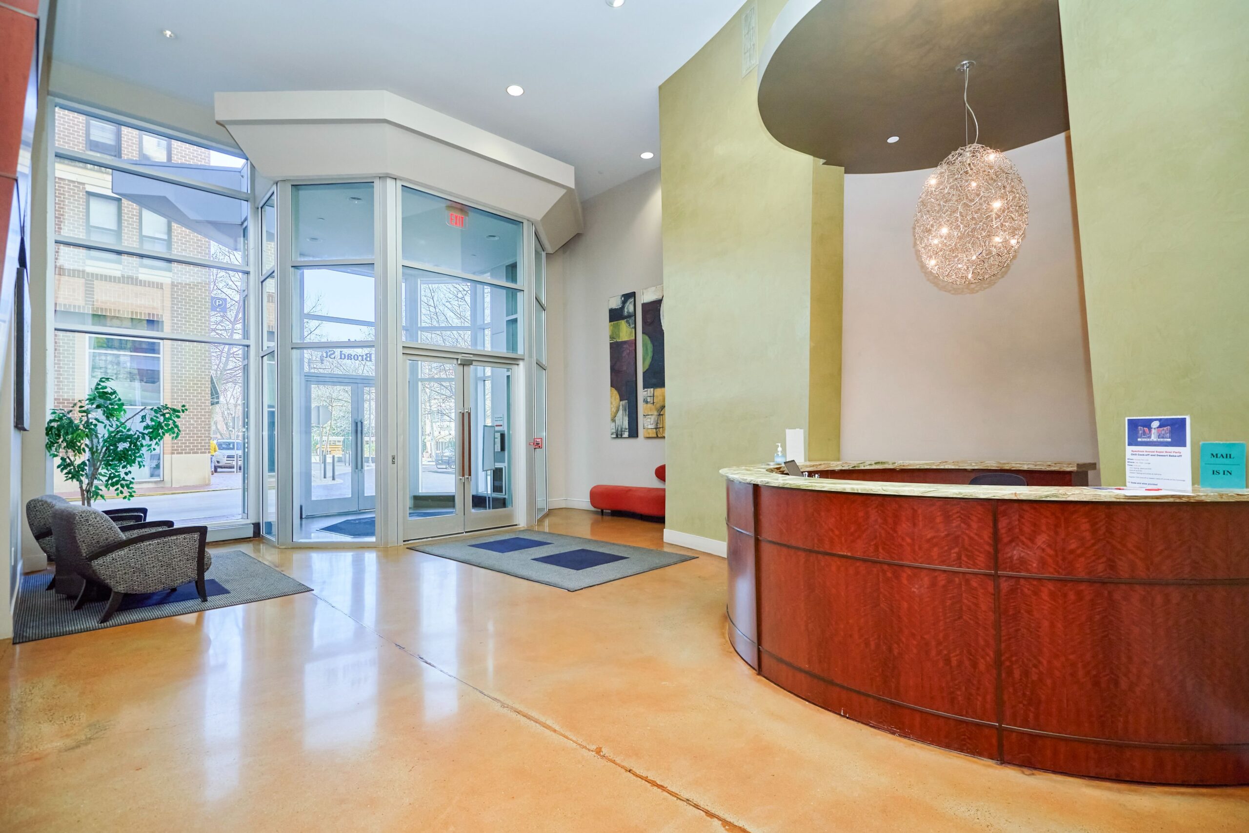 Professional interior photo of 444 W Broad St Unit 631 - showing the concierge desk at the building front entrance